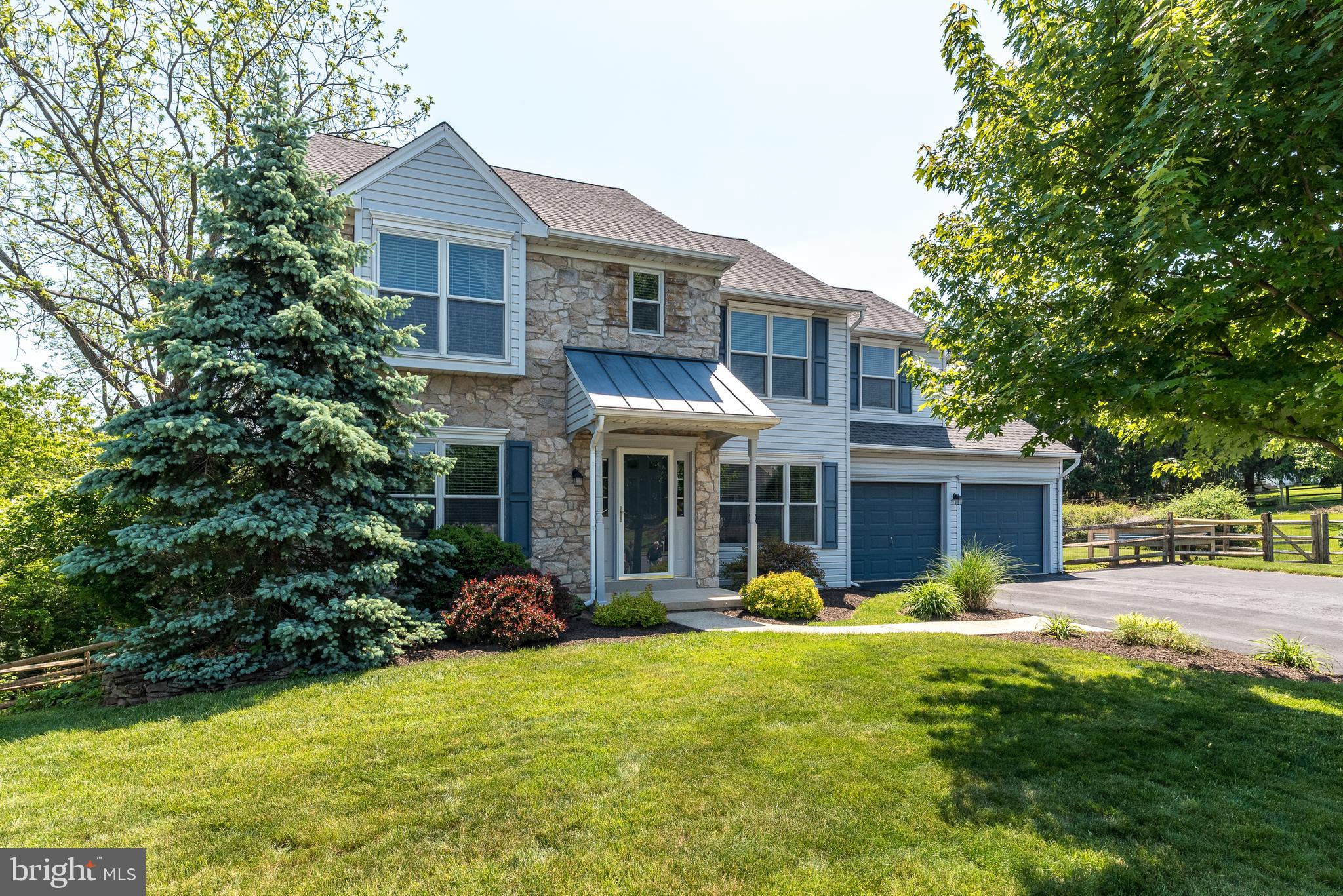 You want a home with an idyllic setting on a cul-de-sac?  One that’s been thoughtfully expanded, upgraded & meticulously maintained?  In Franconia Township & Souderton Schools?  Welcome Home!  Lovely Brazillian Cherry Flooring throughout the 1st floor.  The Entry Hall is flanked by a Sitting room with double glass doors & a double window & the Dining Room with Triple Windows & Brazillian Cherry floors. Head down the hall to a convenient Powder Room & a Den area with Built In Shelves & Cabinets surrounding the cozy Fireplace, a great place to start your day.  It’s open to the stunning Kitchen with 9 Upper Cherry cabinets complete with Crown molding & a Tile backsplash with under cabinet lighting & high hat lighting.  Below there’s Granite Counters & loads of Cabinets with a Spice Drawer & Pot Drawers, Vegetable Sink, Pantry Cabinets, Lazy Susans.  The large Island has an & the Deck & the Pool & the Patio.  Head Upstairs & You’ll find the Primary Bedroom with Large double windows, a lighted ceiling fan & 2 Walk In undermount double sink & pendant lighting, the 3 year old refrigerator stays.  The Kitchen  is Open to the Family Room with it’s Vaulted Ceiling, eye ball lighting with Speakers in the ceiling & a Lighted Ceiling Fan.  The Large Anderson Windows on 3 sides of this room give you a lovely view of the Woods Closets with organizers.  The Primary Bath has a Large Tile Walk In Shower with a Corner Seat & Glass Panel & Shower Door.  Built in Shelves keep everything you need handy.   Cherry Double Vanity & a heat lamp to warm you while you dry off.   3 other bedrooms all with closet organizers & blinds & a hall bath with a large vanity & a door to separate the Shower over Tub & Toilet area.  Don’t forget the Finished Walk out Basement with a Custom Stone & Live edge Bar.  Those Posts are real trees!  Cozy corner Stone Fire place.  Plenty of space for lots of Fun!  There’s also a large Laundry/Storage Room.  Step out side to the lovely paver Patio & step into the
 heated Workshop.  Off the family room, sliders open to a Custom Deck with an electric retractable awning.  Waterfall stairs lead to the Patio & the Gazebo with it’s large electric fan & curtains (it stays) & the lovely 9 foot deep Sylvan Pool & Hot Tub.  The Pool equipment is neatly concealed in the Pool Shed.  The outside Shower & Toilet are also concealed by a Custom Shed.  Just watch out for Hot Air balloons!  Complet this picture with a 2 Car attached garage with inside access & Auto door opener.  It's got lots of cabinets for storage.  Don't miss this one!
