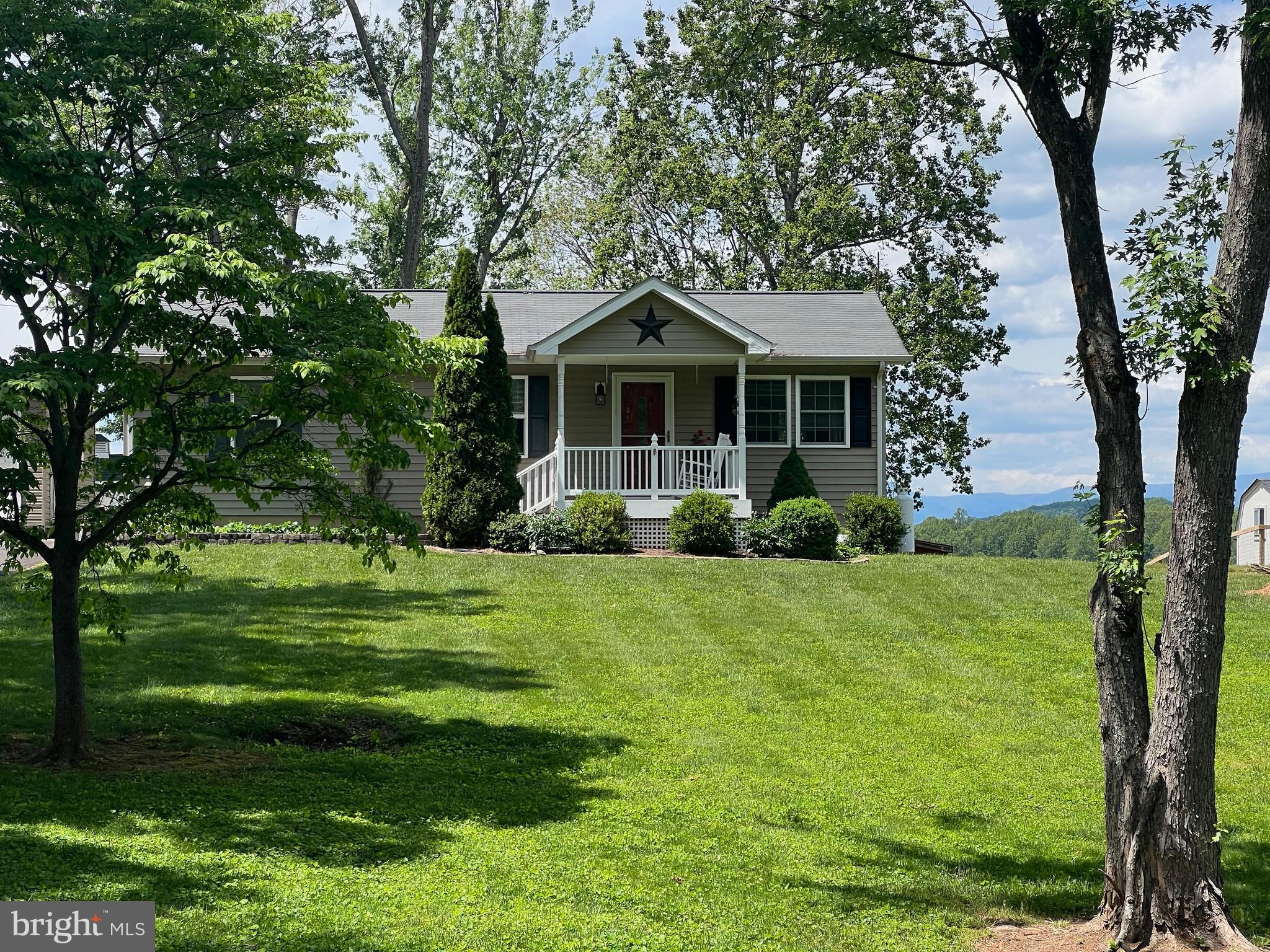 Charming 3/2 Rambler with open Kitchen/Living.  Paved drive, 1 car detached garage, screened gazebo, storage shed with power.  Gorgeous Blue Ridge Mountain views,  on low-traffic paved Birmingham Rd, extremely convenient to Hwy 29 in Culpeper.