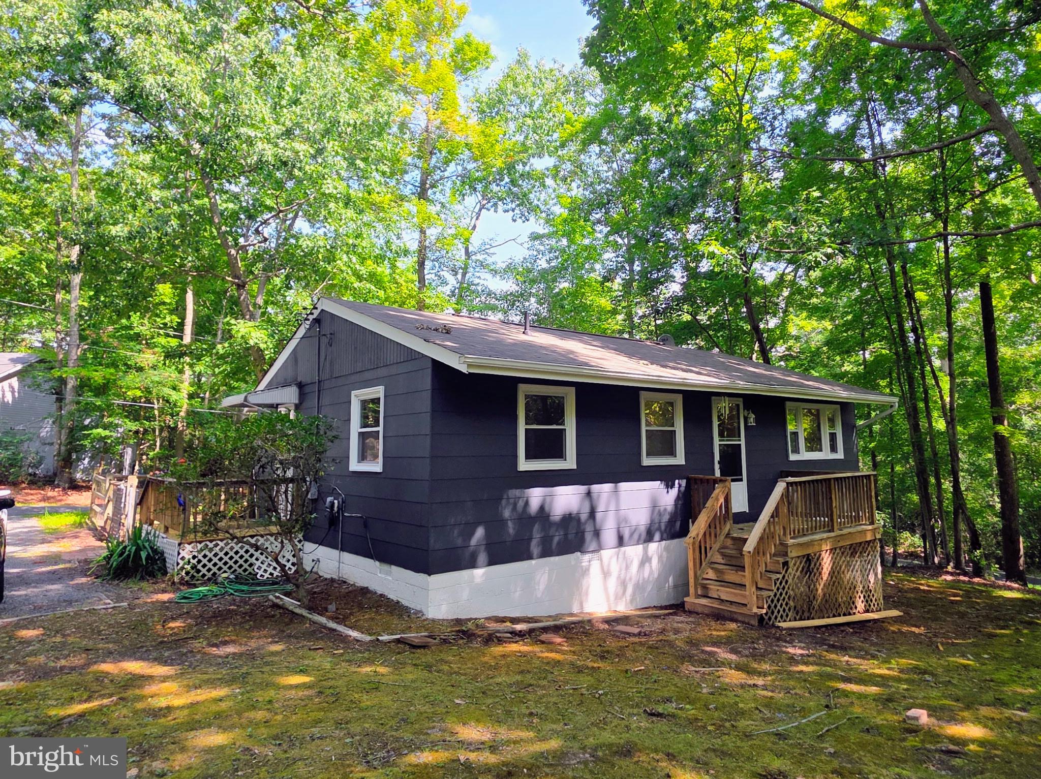 Cute Ranch Style Home on a .24 Acre mostly Wooded Lot ** Recently Updated ** Kitchen has brand new LVT Flooring, a Gas Oven, Refrigerator and Dishwasher (which is approximately 3 years old) * Stackable Washer and Dryer * Spacious Living Room * Laminate Flooring Throughout * All New Ceiling Fans with Lights * HVAC is less than a year old and has a New Thermostat * Some new duct work in one of the Bedrooms and Office/3rd Bedroom * New Outside Lighting * Fresh Paint Inside and Out * In 2009 home was updated with Vinyl Clad Double Pane Tilt Out Windows and new Hot Water Heater * New Bathroom installed 2025 * Newly Stained Decks on Front and Back * New Interior Doors * Driveway is in the Back of the House * Back Yard is Partially Fenced In * Very Nice Lot * Lots of Community Amenities Include: Lake Lariat, Beach,  Trails, Rec Center, Tot Lots/Playground, Community Garden & More!  Conveniently located not far from PAX River Naval Base, Shopping, Solomons Island, Patuxent River, Chesapeake Bay & so much more!