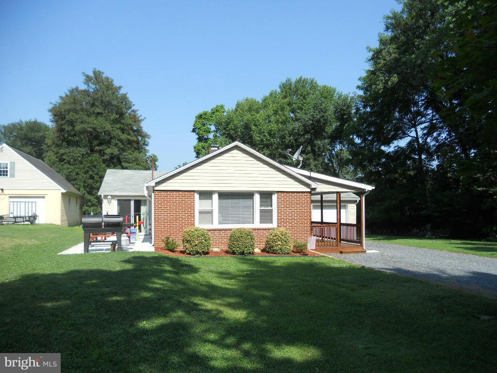 2 bedroom ,2 bath brick and siding rancher with covered porch,deck and patio.Updated kitchen, baths,electric,plumbing and HVAC system.Newer roof,siding,windows and appliances. 1 car garage.Living room with fireplace.Liberty Road address but located on common driveway  with large lot.Radon System.