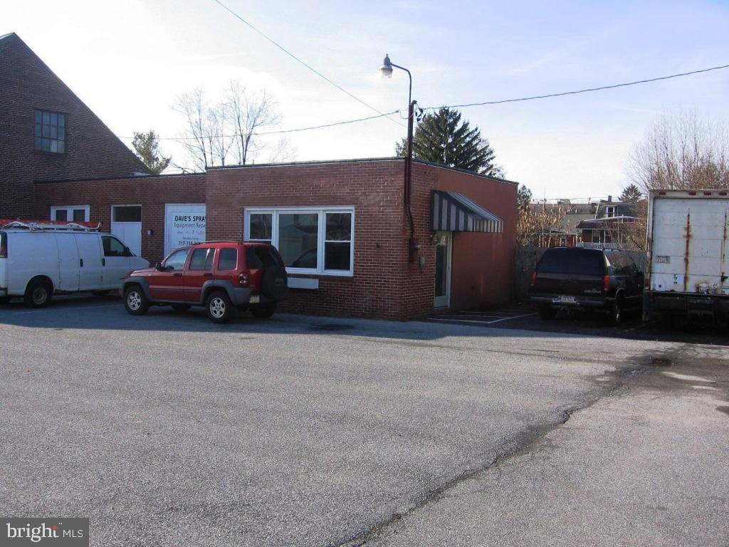 Space is at the rear of the main building at 116 West Chestnut Street. Previous use was a two station beauty salon. Could be used for retail or office space. Includes full bath, kitchenette and laundry.