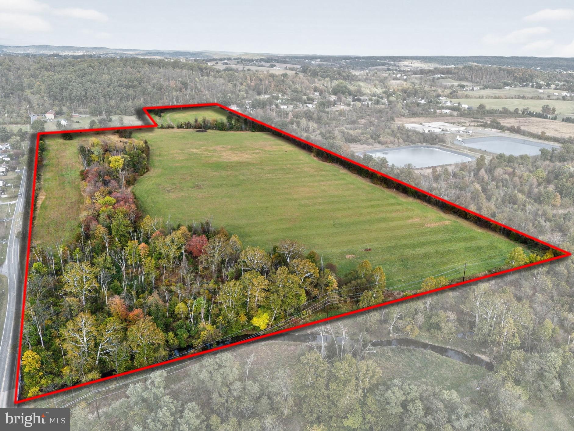 51.6 acres in Colebrookdale Township, Berks County - Prime vacant land parcel with  frontage along Spring Garden Drive and Township Line Rd. Zoned LI – Light Industrial, the property offers a variety of potential uses. Public sewer in street on Spring Garden Dr.  Convenient access only 1/4 mile to Rt.100 interchange and close proximity to Boyertown Borough. The property is currently enrolled in Act 319 for reduced property taxes. The property's southern boundary borders Swamp Creek. Buyers should confirm with the township code enforcement office LTL Consultants regarding allowable uses, development standards, and sewer connections. A rare opportunity for investment or development in a growing industrial corridor.
