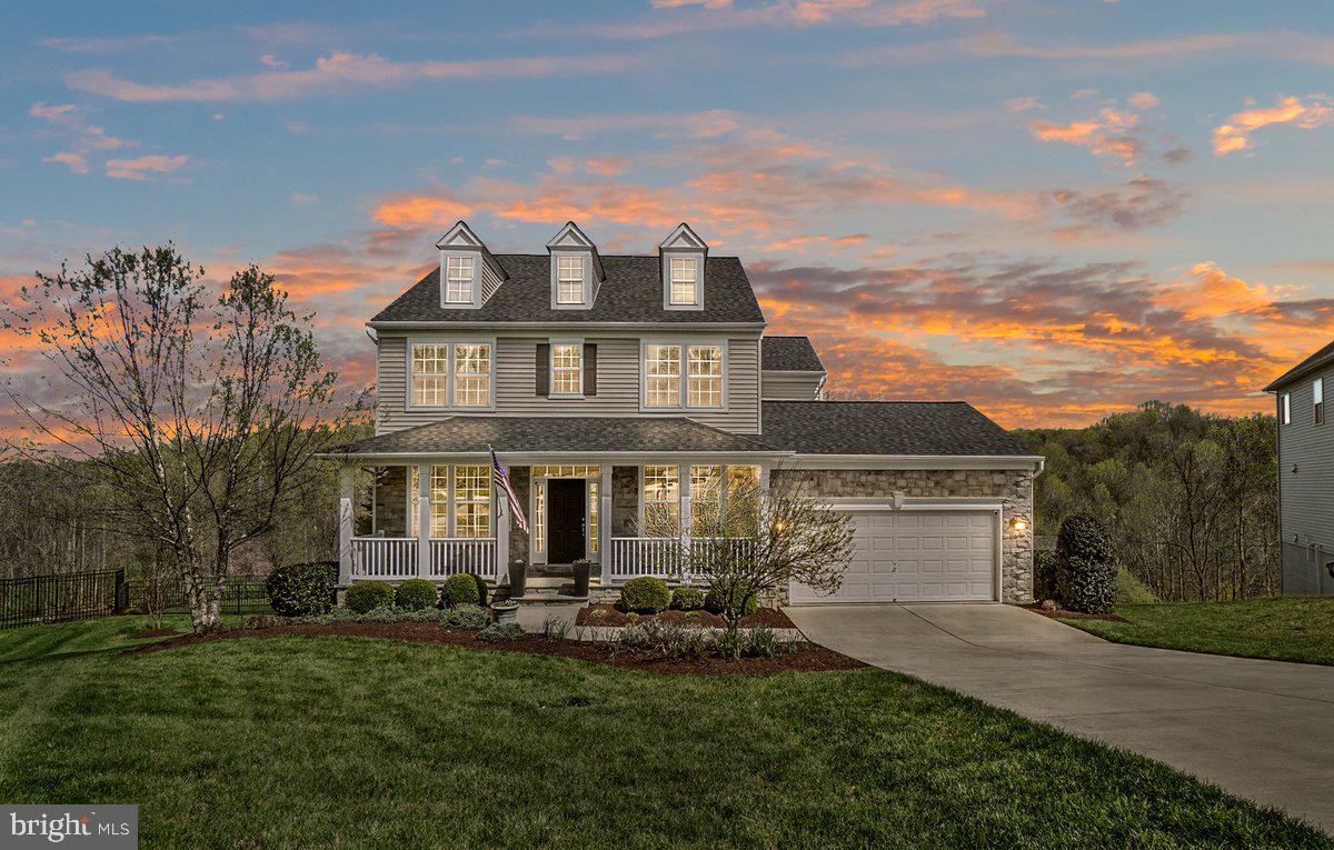 Welcome to The Daphne – An Exquisite  Gem in Clearview at New Market
This stunning 4-bedroom, 2.5-bath home is lovingly maintained by the original owners and shows better than a model. Nestled at the end of a peaceful cul-de-sac, the stone-front elevation offers fantastic curb appeal while providing a private backyard retreat—perfect for entertaining or unwinding in peace.
Step inside and you'll immediately notice the designer-inspired finishes throughout. From upgraded lighting in the kitchen and primary bedroom to gorgeous granite countertops, stainless steel appliances, and rich maple cabinetry in both the kitchen and butler's pantry—no detail overlooked. The large kitchen island provides ample workspace and a natural gathering spot for friends and family.
The main level features beautiful hardwood flooring that flows seamlessly through the open-concept layout, creating a warm and welcoming atmosphere. The hardwood  extends to much of the upstairs as well. Fresh, modern paint colors complement the space with style.
Step out into the huge owner-added screened-in porch with natural wood ceiling —an ideal spot for morning coffee or a quiet afternoon read. The backyard is a showstopper, with resort-style dual-level patios offering both sun-drenched and shaded options. A built-in grill, connected to the buried propane tank, means you’ll never need to worry about swapping tanks mid-barbecue again!
Upstairs bathrooms feature large-format tile, adding a sleek and durable touch. The spacious primary suite and additional bedrooms include custom built-out closets, maximizing organization and style.
The walk-out basement is massive, with two separate entrances and a rough-in for an additional bathroom, giving you endless potential for customization—think guest suite, gym, or entertainment space.
And don't forget the rare 3-car tandem garage—perfect for vehicles, hobbies, storage, or even a workshop. The meticulously maintained landscaping completes this dream home package.
Located in the sought-after community of Clearview at New Market, near some of the best schools around, this home blends upscale features, thoughtful design, fantastic location and unbeatable outdoor living.