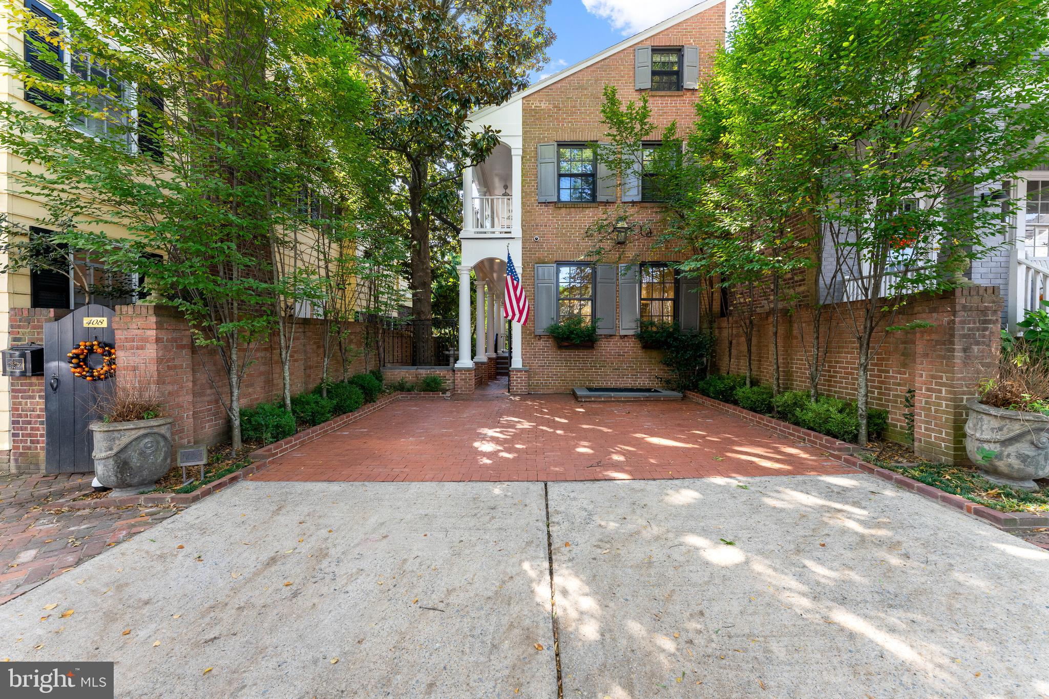 Nestled snugly in the heart of Old Town, this spectacular home is draped in luxury and all the magnificent features a property like this deserves. With high ceilings and huge east facing windows, this home is awash in light and elegance. The rooms are adorned with timeless wood work and reclaimed pine floors that present a historic but classic look that is both contemporary and traditional. The home had been renovated with all modern fixtures including Miele appliances, dual zone HVAC, updated lighting and a sophisticated alarm system. The main floor is divided into a formal living room with a gorgeous fireplace accompanied by an antique mantle and then travels back to a modern open kitchen with generous island that transitions to an area perfect for dining and entertaining.   Beyond that is a take on a butler’s pantry with wet bar and wine storage, a half bath and then an exterior door leading out to a patio designed just for grilling. Upstairs, a spacious master primary suite that boasts a walk in closet, soaking tub, glass shower and a gas fireplace for chilly winter mornings. The laundry is located in the hallway just outside heading to the second bedroom which has its own large fireplace with carved mantle. Here a door leads out the Charleston style veranda overlooking the mature trees, back yard and street. The top floor has what could be an excellent media room, framed on either side by two more bedrooms and an amazing porthole themed bathroom. Downstairs is a finished basement area with a full bath, storage, a bedroom with fireplace and its own separate entrance. Outside offers a wonderful patio area with a mounted all weather TV making this almost like having another room in fine weather. Turf covers a walled garden area perfect for dogs or baseball and an almost hidden brick path that leads past the mature landscaping, basement entrance, front door and out to the two off street parking spots complete with electric vehicle charging station. This is truly a unique property that is effortlessly a part of the Old Town experience.