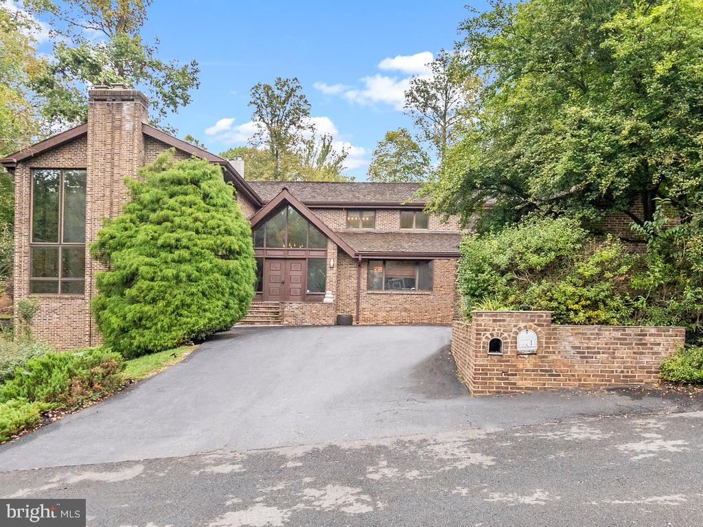 ***OPEN HOUSE Sunday 10/24 from 2pm to 4pm*** Welcome to 621 Potomac River Rd, an extraordinary and unique contemporary brick and glass home in the exclusive and sought-after Potomac Overlook community of McLean. Boasting 6 large bedrooms and 5 ½ bathrooms spread over more than 6000sq.ft of space, this magnificent property is nestled at the end of a private cul de sac with views of natural woodland.  Enjoy the serenity of this home which features gleaming hardwood floors, 3 stone fireplaces, dramatic high ceilings and large windows that let in tons of natural light.  Additional features include an expansive modern kitchen with large center island, exercise room, a music studio, large owner’s suite with steam shower, incredible light filled basement rec room and a 3-car garage. The backyard is a private oasis with a multilevel stone patio leading to a beautiful swimming pool. You can lounge, soak up some sun and entertain your guests day or night, all in absolute privacy and surrounded by mature trees.  The property is extremely close to Scott’s Run Creek, with 336 acres of hiking trails, streams, and incredible views of the Potomac River. Langley School Pyramid. Great location close to major commuting routes, airports, & Tysons Corner. This is a must see!