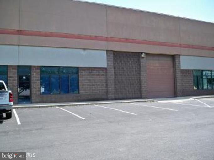 3,100 s/f foot print with a additional 2nd floor approx 1,200 s/f, net 4,300 s/f (+-). Open high bay drive in warehouse, sprinkled. Climate controlled show room include w/w carpet. 2nd floor has hvy steel floor trusses for heavy weight storage. CONDO FEES are aprox $130 @ month. Ideal usage , Contractor, welding & sheet metal shop, wholesale / retail sales  with warehouse storage.