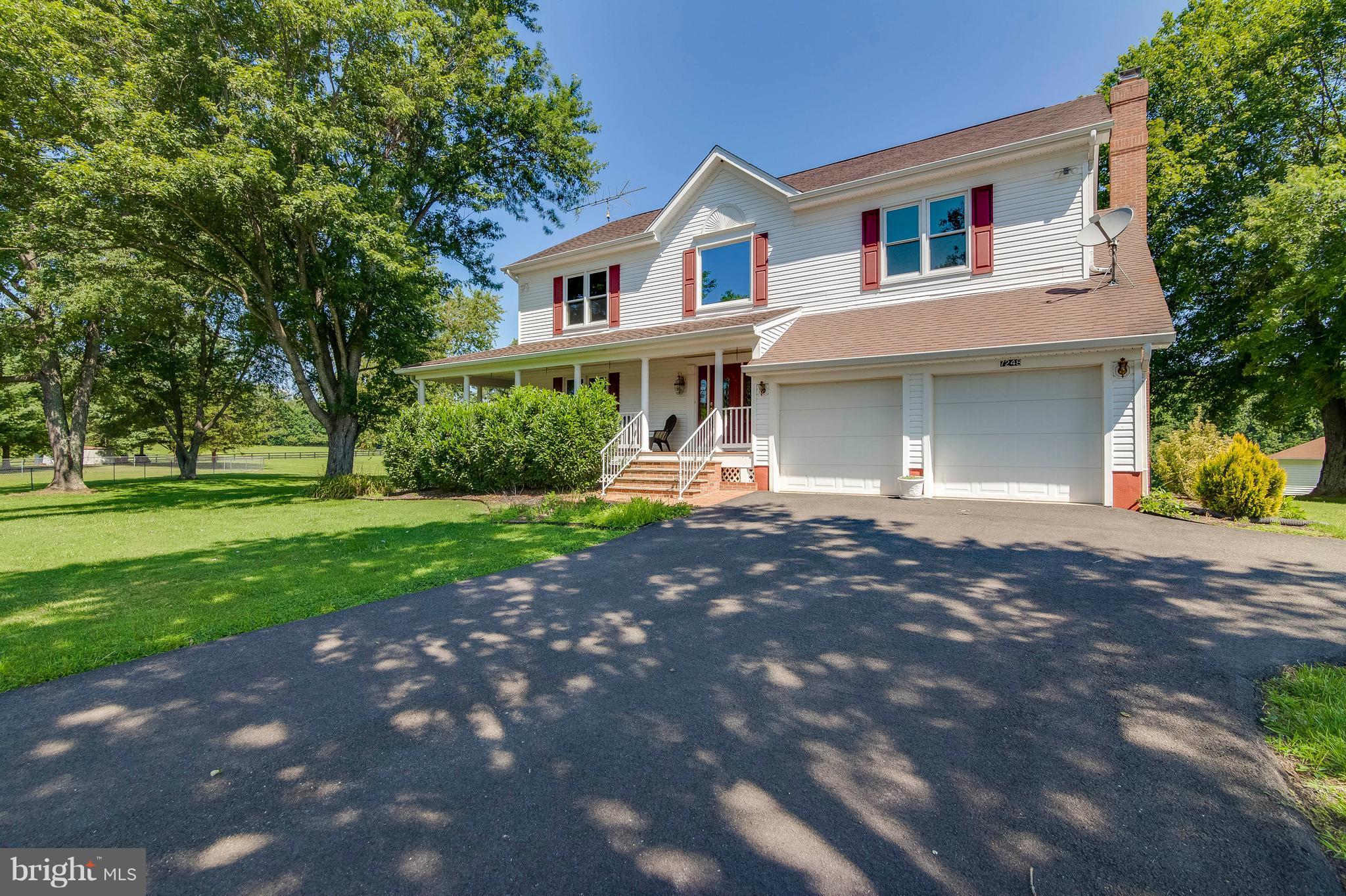 SIMPLY STUNNING, START WITH ME! This immaculately presented home includes a gorgeous gourmet kitchen that opens to the family room. The main level also includes a spacious dining room, formal living room; all perfect for entertainment! Polished hardwood flooring found on the main level. French door leads out to deck, enjoy coffee with beautiful views! Second kitchen and in-law suite!