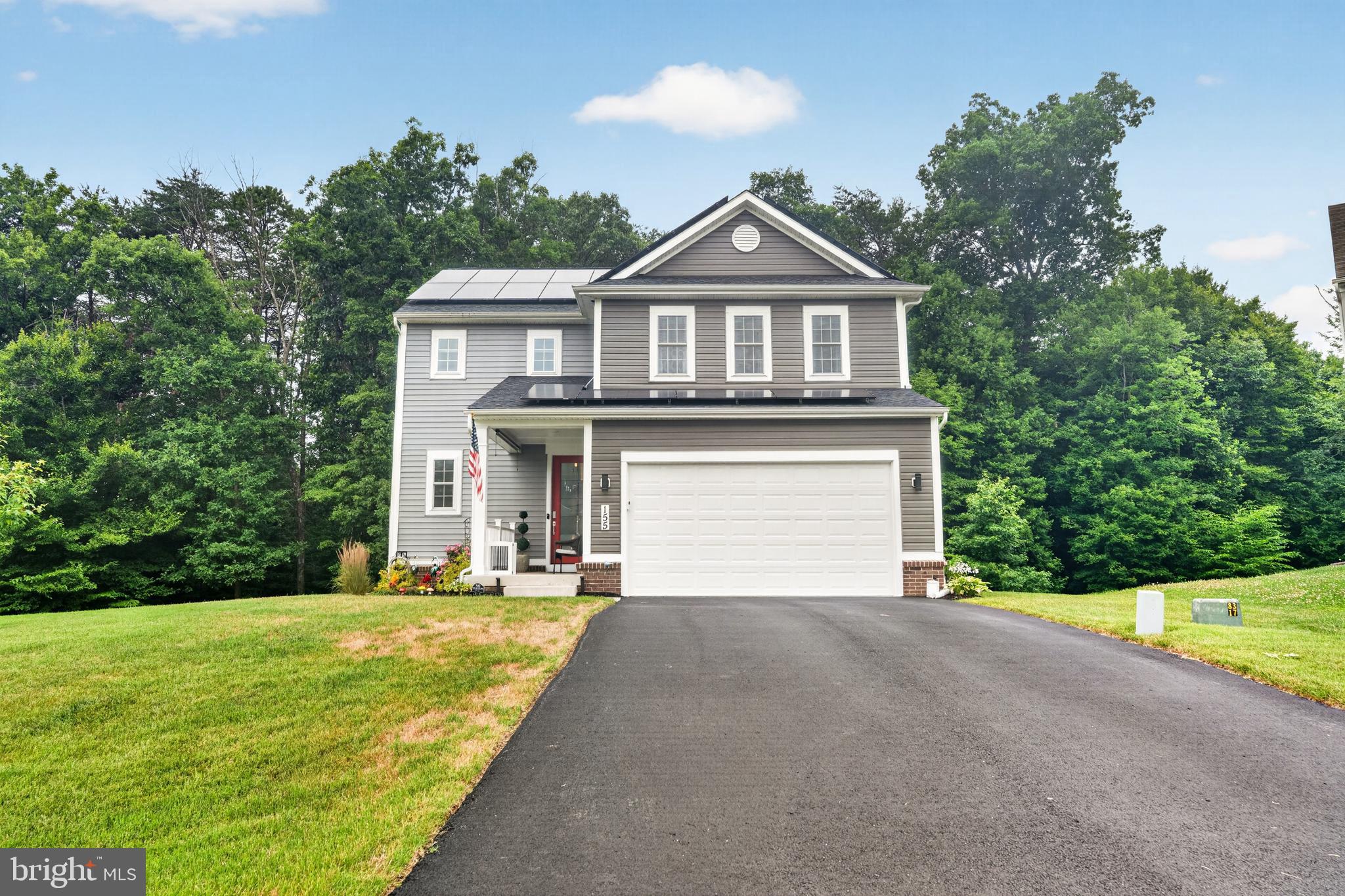 Only available due to relocation! Welcome to this exceptional, nearly new home in the highly desirable Chesapeake Bay Golf Club community. Meticulously maintained and truly move-in ready, this stunning residence is situated on a quiet cul-de-sac backing to a protected forest conservation area that will never be developed—providing exceptional privacy and peaceful wooded views year-round.

Thoughtfully upgraded throughout, this turnkey home offers today's most sought-after features. The gourmet kitchen is the heart of the home, showcasing a large center island, premium stainless steel appliances, a custom tile backsplash, soft-close cabinetry, pull-out cabinet organizers, and abundant storage—making it equally suited for entertaining or everyday living.

The open-concept floor plan is enhanced by impressive 10-foot ceilings and luxury vinyl plank flooring throughout the main level and bathrooms, creating a bright, spacious atmosphere. Just off the kitchen, the dining area features an expansive wall of sliding glass doors that fills the home with natural light and seamlessly connects the interior to the outdoor living space. Step outside to the maintenance-free 12' x 16' composite deck with stairs and landing, overlooking the tranquil wooded backdrop—perfect for morning coffee, outdoor dining, or relaxing in complete privacy.

The inviting great room is both elegant and comfortable, featuring custom window treatments and a ceiling fan, while oversized windows throughout the home allow natural light to pour into every room.

Upstairs, plush carpeting leads to a versatile second-floor loft, ideal as a family room, media space, home office, or play area. The convenient upper-level laundry room includes additional cabinetry for extra storage. The spacious secondary bedrooms provide comfortable accommodations, while the primary suite offers a peaceful retreat complete with a large walk-in shower and an oversized walk-in closet. Both bathrooms feature upgraded comfort-height vanities with added storage and upgraded elongated comfort-height toilets.

The semi-finished basement offers outstanding potential for future expansion with space for a recreation room, home gym, media room, or workshop while still providing generous storage. A full bathroom rough-in has already been started, and the egress window makes future finishing even more convenient.

Additional premium features include a professionally installed battery backup system that powers the sump pump, three basement outlets, and the kitchen refrigerator for several hours during a power outage, providing valuable peace of mind. Even better, the owned solar energy system delivers substantial long-term utility savings while increasing your home's energy efficiency. (Please see the additional documents for complete details regarding the solar system.)

Conveniently located just minutes from I-95, historic downtown North East, marinas, waterfront dining, and the Chesapeake Bay, this exceptional home offers the perfect combination of luxury, privacy, energy efficiency, and convenience.

This is a rare opportunity to own a beautifully upgraded home on one of the premier lots in Chesapeake Bay Golf Club. Schedule your private tour today!