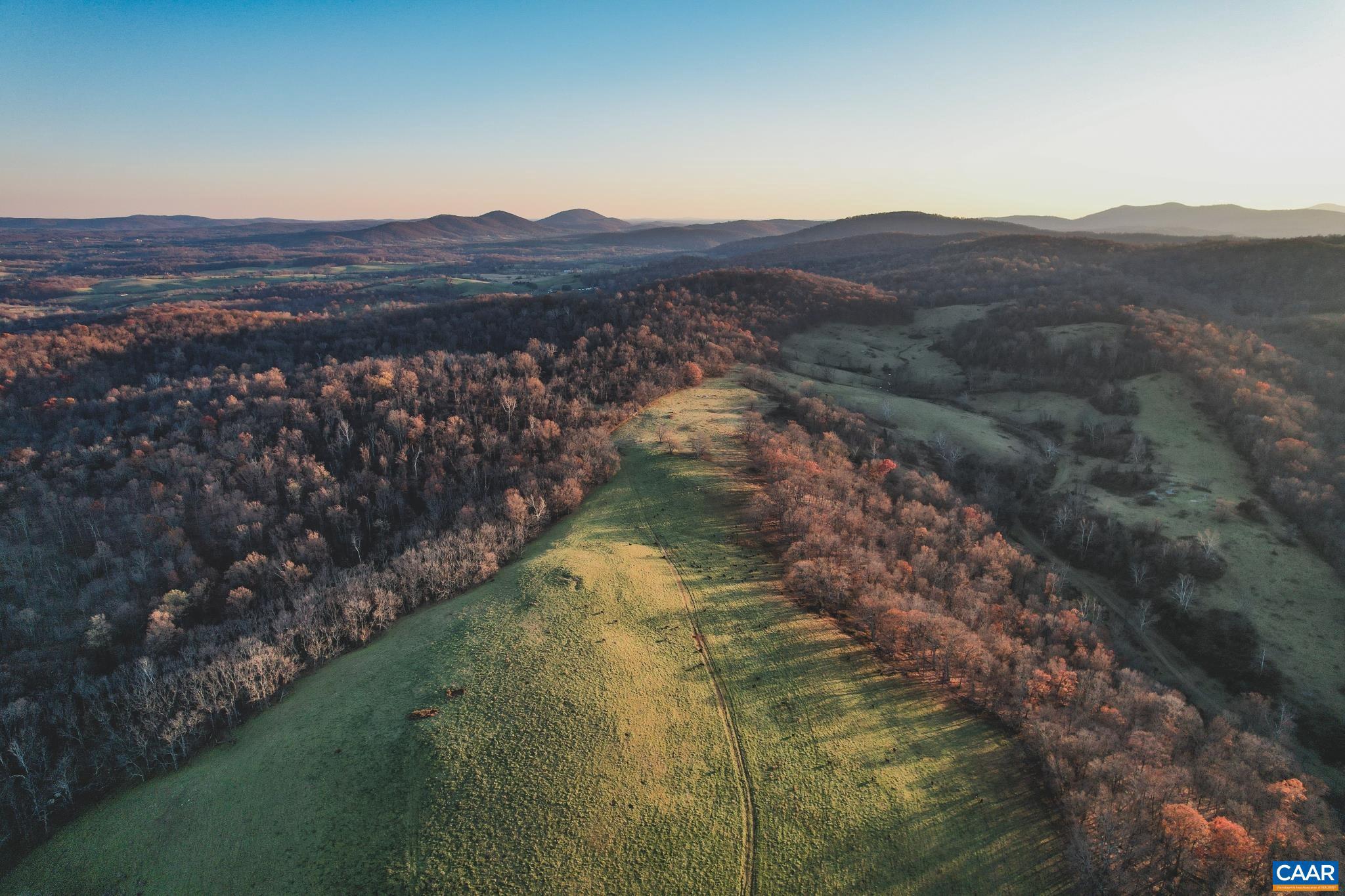 This stunning 490 acre tract is located in one of Virginia's finest vineyard and equestrian areas, less than an hour from Washington, D.C. The rolling hills lead you to breathtaking, 360 degree mountain and pastoral views. This land has approximately 155 acres of beautiful, open pasture land and approximately 335 acres of mixed timber which includes many red oaks and some very old white oaks. There is a creek that runs through the property that connects to Crooked Run creek to the North. A good trail network connects the multiple fields and winds through the timber; providing excellent opportunities for walking, riding, or hunting access. There is an abundance of wildlife on this land including white tailed deer and turkey. This property is fully fenced for cattle, with the main entrance gate off of Leeds Manor Rd. There is approximately 3,000 ft of frontage along Leeds Manor Rd. There is a 20 acre section already zoned commercial, which is an excellent opportunity for a new vineyard site. This is also a great opportunity for a home with mountain views and plenty of acreage to enjoy, only minutes from the renowned historic towns of Middleburg and Upperville. Recent survey on file. 4 BR Perk. Can divide. No conservation easement.,490 Acres with Stunning Mountain Views