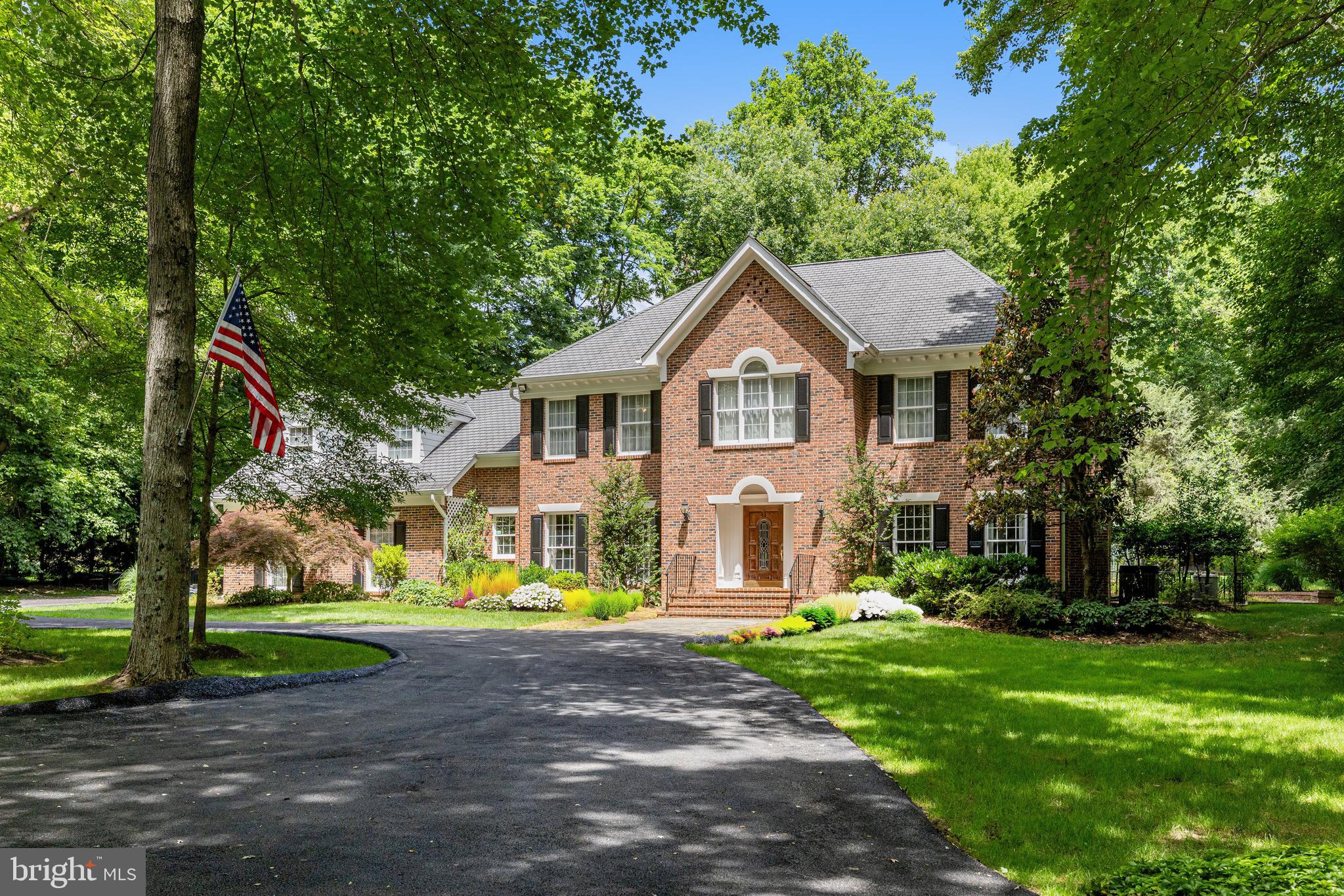 Sited on a private 2-acre lot in central Great Falls, this handsome property is convenient to shopping, dining, major transportation routes and is in the LANGLEY SCHOOL PYRAMID  in one of Northern Virginia’s most sought-after communities in central Great Falls, less than 5 minutes to the village. ****This stunning all-brick colonial with detached GUEST COTTAGE is country living at its finest! ****The separate detached guest cottage provides an exceptional bonus: a complete kitchen, family room, bedroom, full bath and laundry room---ideal for extended family, visiting guests, or an inspiring home office.*****The main residence offers 4 spacious bedrooms, newly refinished hardwood floors on main and upper levels, fresh designer paint, stylish new fixtures, and a brand-new luxury primary bath. A spectacular chef's kitchen with stainless steel appliances and adjacent breakfast room with masonry fireplace creates a warm and welcoming ambience. Five masonry fireplaces. The sun-filled living spaces flow seamlessly to the outdoors, where extensive hardscaping—including stone patios and classic brick knee walls—create the perfect backdrop for entertaining or relaxing in your private sanctuary.*****An extra add-on for the hobbyist is a special devoted workshop adjacent to the guest cottage.****Practical touches include a large asphalt circular drive for easy arrivals and ample parking.*****Nestled in a central Great Falls location, you’re minutes to shopping, major commuter routes, and the top-rated public schools that make this area so desirable.*****This is more than a home—it’s a lifestyle.!