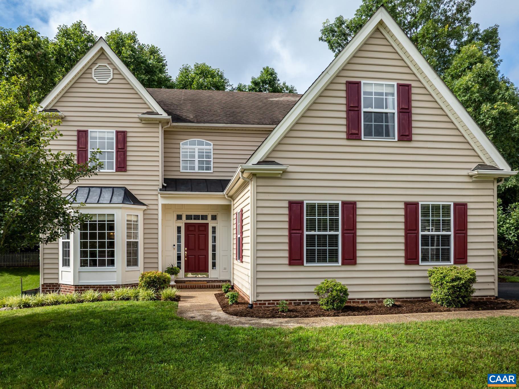 This lovely colonial is nestled in Crozet's desirable Grayrock neighborhood.  It boasts five bedrooms, three and half baths and mountain views from the second floor.  On the main level, you will find the foyer, dining room, kitchen, breakfast nook, laundry room, half bath, one of the primary bedrooms, and a large great room with vaulted ceilings and a gas fireplace.  The second level offers the second primary bedroom and 3 additional bedrooms.  One of the bedrooms is currently being used as a playroom/office. This home has tons of built-ins and lots of closet space.  There is a charming backyard with a patio, pretty landscaping, and a newly installed wooden fence.   Grayrock has two ponds and two playgrounds to enjoy.  Downtown Crozet, vineyards, orchards, trails, and I-64 are within close proximity.,Painted Cabinets,Fireplace in Great Room
