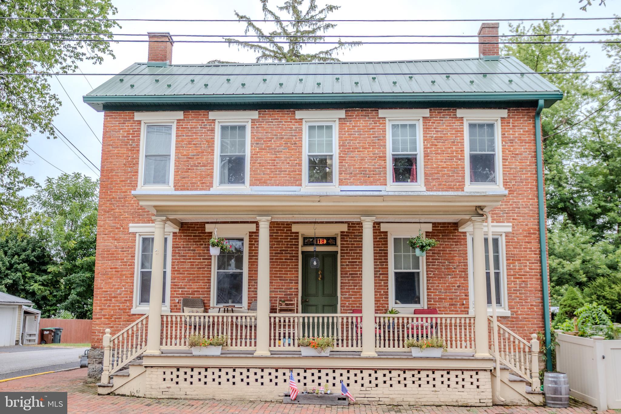 Own your own piece of history and celebrate this home's 150th birthday by giving it a new owner!This Federalist style all brick home offers all the charm and history of the past with some of of today's conveniences. The first floor boasts high ceilings unique for the age of the home ( just shy of 9').  An updated kitchen with new counters, deep farmhouse sink and full coffee bar opens up to a large parlor w/ fireplace which could serve as a dedicated dining room.  A large living room and office with built ins and 1/2 bath round out the main floor. Original hardwoods, trim, stair case and stained glass transom are features that can't be duplicated today.  The second floor features a converted owner's suite with large walk in closest, full bath with integrated laundry and two additional nicely sized bedrooms round out to upper level a full walk up attic and back stair case are neat extras.  Outdoor living options also abound on the brand new composite deck overlooking the back yard and historic Norway Spruce.  The carriage house contains oak plank flooring and is currently used as wood shop but could function as a garage.  Sitting on the front porch is great way to spend warm evenings and enjoy downtown events.