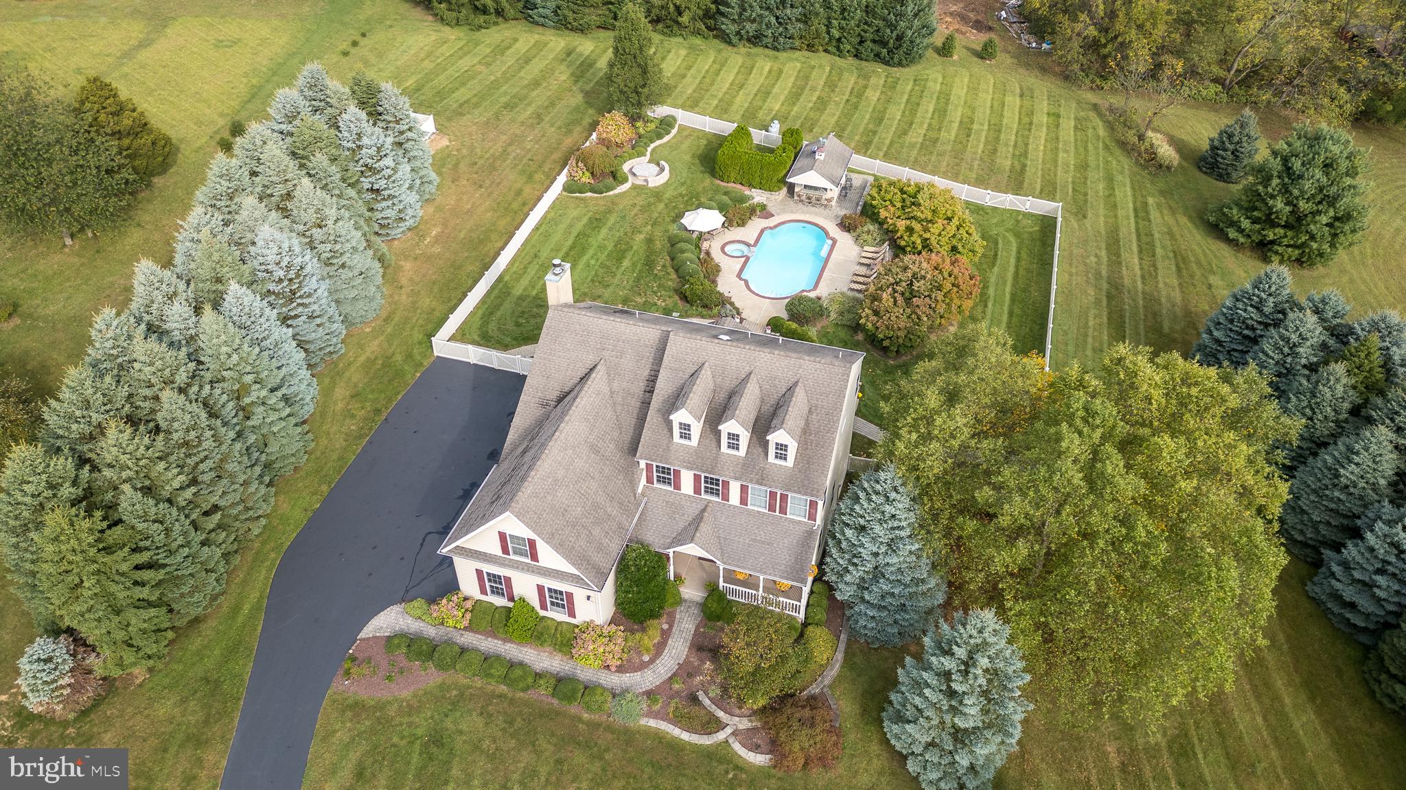 Beautifully maintained home on a cul-de-sac road with extensive landscaping, hardscaping, pool, hot tub, fenced in rear yard and walk out basement.  Welcome to 30 Alexander Dr a perfectly placed home, back from the road, with an extensive private back yard perfect for entertaining.   As you walk up the path to the front door you know you are somewhere special with a covered front porch perfect for your rocking chairs.   Enter the home to the two-story foyer with a chandelier lift.   There is a living room that opens to the formal dining room with new flooring, tray ceiling and shadow boxes.   The spacious kitchen has tile floors and opens to the family room with a stone wood burning fireplace and wall of windows.   There is a lovely morning/sun room that is flooded with natural light and is perfect for enjoying your morning coffee.   Radiant heated tile floors run throughout the kitchen, family and sun room and a half bath completes the first floor.   Upstairs you will find a large master bedroom suite with a sitting room and three closets including a large walk in.  The master bath features a soaking tub, skylight, tile shower, 2 sinks, vaulted ceiling and a bidet!  Three more bedrooms, a hall bath and laundry room are found on this level.   The walkout basement has a lovely full bathroom and space for all your storage, hobbies or is ready to be finished for additional living space if desired.   Built for entertaining the rear of the home and property is nothing short of spectacular.   Starting with the Azek deck with integrated lighting that runs the full width of the house to the beautiful pool with a built-in hot tub.   Drinks are served up from the pool house with 60amp electric service.   As night falls everyone will be gathering around the hardscaped propane firepit.   There is a three-car attached garage with an epoxy coated floor and slat wall system making organization a breeze.  Did I mention the whole house generator?   Located in award winning Palisades School District this home provides everything your family has been looking for and the best the Upper Bucks County has to offer!