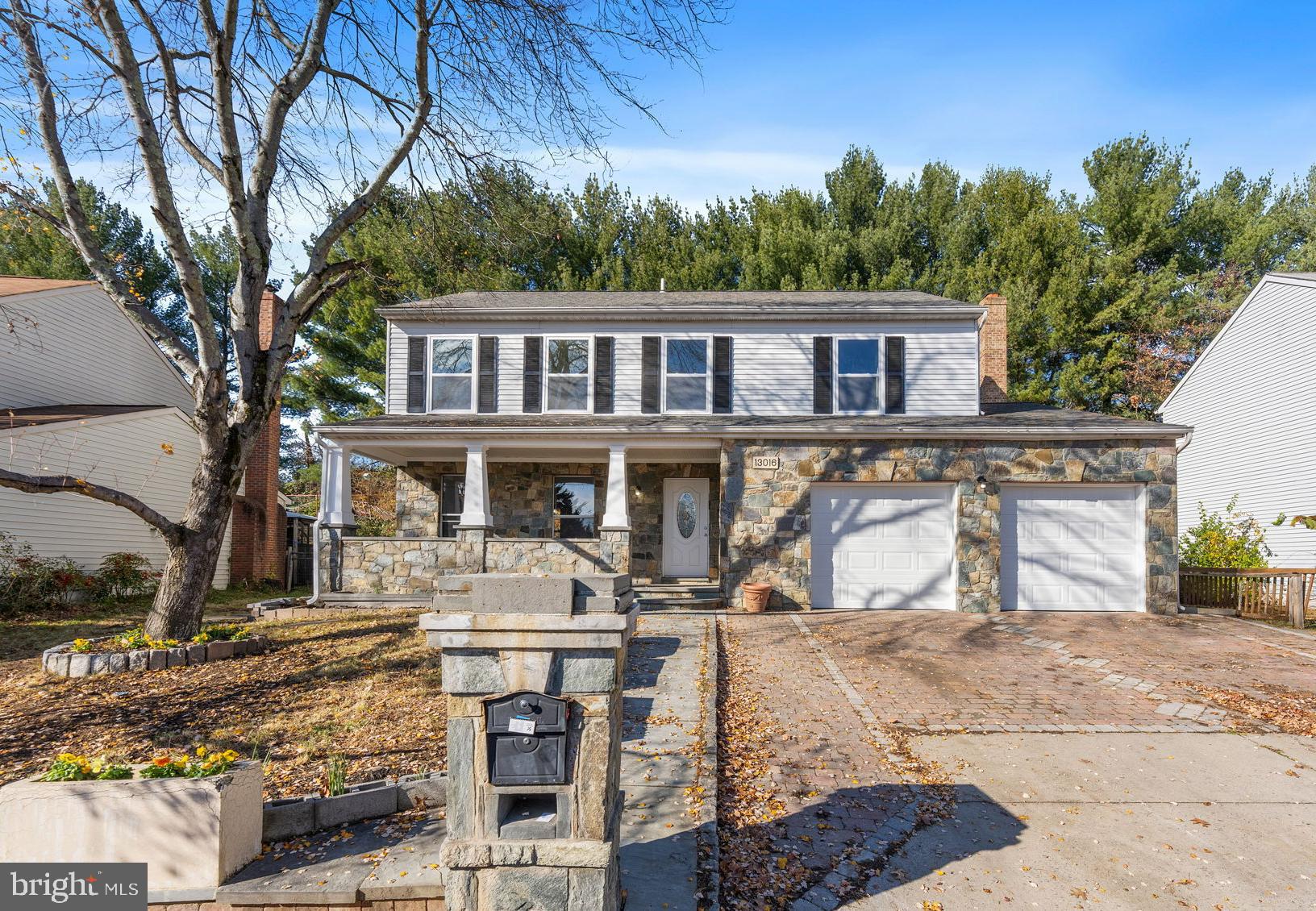 Open House Saturday 7/11 @ 12-3PM. Stunning and extensively updated 4-bedroom, 3.5-bath home offering over 2,700 finished square feet in the highly sought-after Tanglewood neighborhood. Combining the feel of new construction with the space and charm of an established community, this move-in-ready home is sure to impress. From the moment you arrive, you'll appreciate the elegant custom stonework that enhances the front exterior and continues into the backyard, where a spectacular oversized stone patio creates the perfect setting for entertaining, outdoor dining, or simply relaxing in your private backyard retreat. The beautifully renovated gourmet kitchen features new cabinetry, quartz countertops, designer backsplash, stainless steel appliances, and elegant tile flooring. The main level also offers a spacious family room with a stylish tiled fireplace, formal living and dining rooms, and refinished hardwood flooring throughout. New sliding door from the family room lead directly to the fully fenced backyard. Upstairs you'll find four generously sized bedrooms, including a luxurious owner's suite with a large walk-in closet and beautifully updated spa-inspired bath. The finished lower level offers exceptional flexibility with a potential fifth bedroom, guest suite, or home office, an updated full bath, a large recreation area, and walk-up access to the backyard.  Additional updates include a new AC (2025), new water heater (2025), new backyard fencing, replaced garage doors, and newer carpeting. The oversized two-car garage provides ample storage space. Ideally located near Routes 29 and 200 with convenient access to shopping, dining, parks, and major commuter routes, this home offers an exceptional combination of style, comfort, and convenience in one of the area's most desirable neighborhoods.