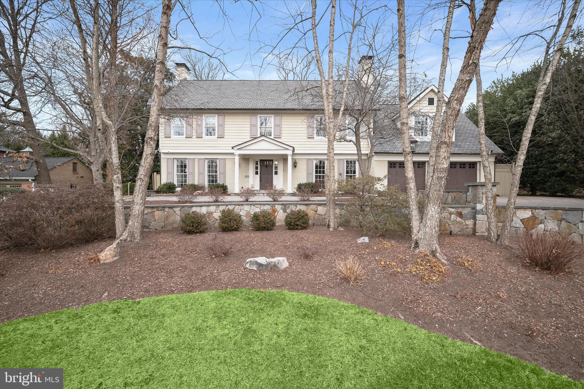 Welcome to this exceptional residence offering over 7,000 square feet of thoughtfully designed living space in the coveted Whitman cluster. From the moment you arrive, the home’s striking curb appeal and elegant circular paver driveway set the tone. Inside, a grand foyer is flanked by sun-drenched formal living and dining rooms, each featuring a wood-burning fireplace, creating an inviting backdrop for both everyday living and entertaining.

A gallery-style hallway leads to the heart of the home: a stunning, updated kitchen with an oversized island, Viking 48-inch gas range and hood, dual sinks, wine fridge, abundant counter seating, and generous storage. The adjoining breakfast area opens to a cozy family room with a gas fireplace and French doors that invite you outside to the spectacular backyard. The main level also includes a fully equipped butler’s pantry/catering kitchen with discreet access to the dining room, along with a powder room and a full bath, ideal for pool guests.

Hardwood floors continue upstairs to the impressive, freshly painted primary suite, complete with a charming Juliet balcony. The spa-inspired en-suite bath features an oversized shower, soaking tub with waterfall edges and ceiling-mounted filler, dual vanities, and ample counter space. A private sitting area leads to two oversized walk-in closets with custom built-ins. Four additional bedrooms complete the upper level, including two with en-suite baths, along with an updated hall bath and a convenient laundry room. The third level offers a versatile loft space perfect for a home office, playroom, or creative studio. The lower level is an entertainer’s dream, featuring a spacious recreation room with a fourth fireplace, home gym, theater room, temperature-controlled wine room, and a large game room with a built-in bar. A full legal bedroom with walkout access and a full bath completes this level.

Step outside to a true backyard oasis. Enjoy an expansive stone patio with a two-tiered layout, plenty of green space for play or a swingset, and a heated saltwater pool, all fully fenced and surrounded by mature landscaping for exceptional privacy. An added bonus is the detached two-car garage behind a secure gate, topped by a carriage house with a fully equipped apartment, offering incredible flexibility for guests or multigenerational living.

Located in the highly sought-after Bradley Manor neighborhood, just minutes from Fernwood Park, Wildwood Shopping Center, and a variety of public and private schools, this remarkable home offers luxury, versatility, and an unbeatable location.