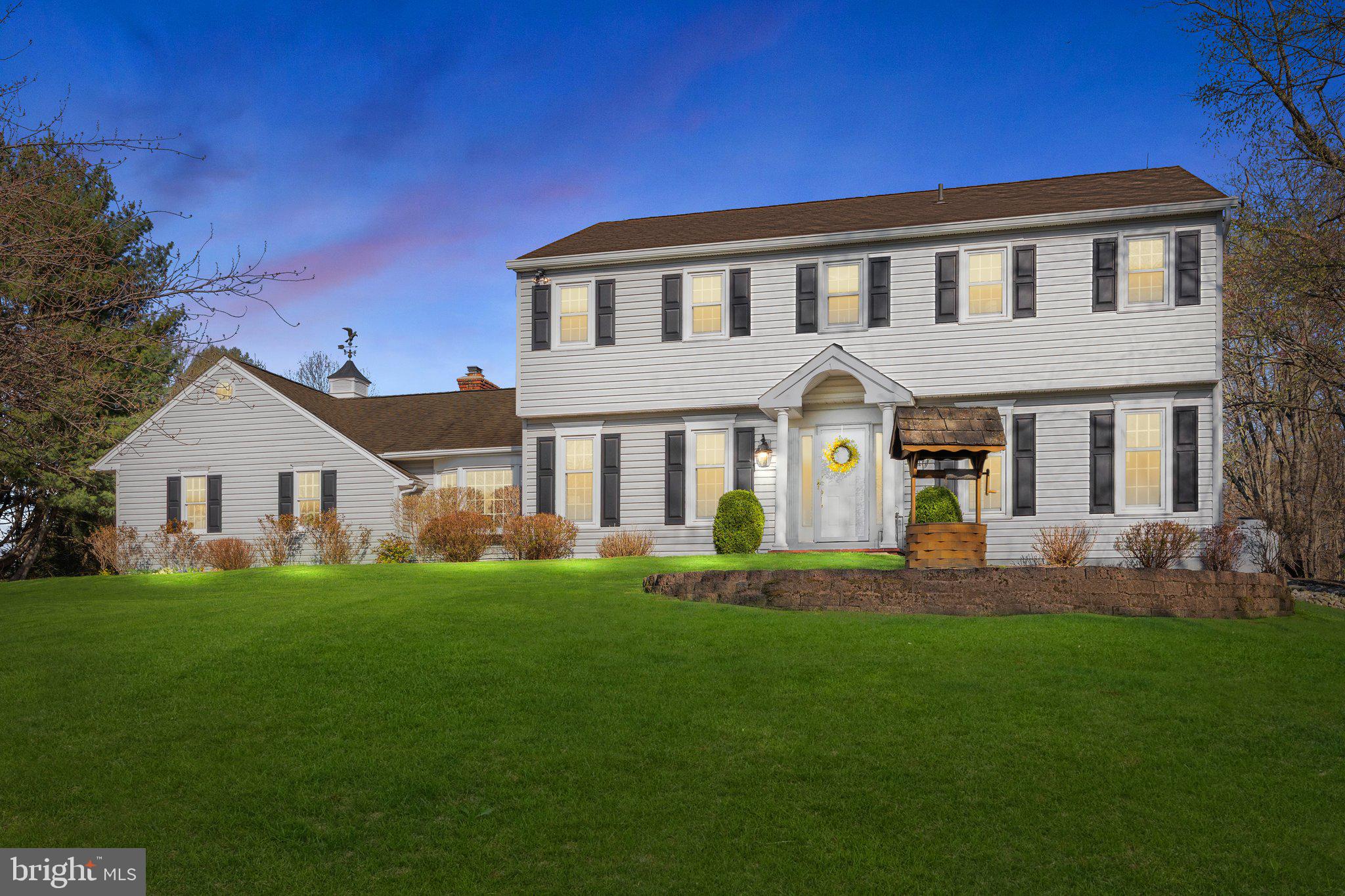 Welcome to your dream home at 85 Brownsburg Road, Newtown, PA! Nestled down a private, cherry blossom-lined driveway, this stunning center hall colonial is a true sanctuary with 4 bedrooms, 2.5 bathrooms on a 2.44 acre lot.

As you approach, the charming brick walkway guides you to a warm and inviting entrance. Step inside and be greeted by a thoughtfully designed foyer, perfectly positioned between the formal dining room and the incredible office featuring a full wall of custom built-ins.

The heart of the home is undoubtedly the custom, eat-in kitchen, featuring double islands, top-of-the-line stainless steel appliances, many pantry cabinets for an abundance of storage, 2 sinks, 2 dishwashers, 36in gas range with hood vent, decorative accent lighting, an electric oven in island, microwave drawer, and exquisite Carrara marble countertops and black leathered granite tops. The uniqueness of this space is further highlighted by wood-planked vaulted ceilings and expansive windows that offer serene views of the backyard. Space for at least 4 barstools along the island and a full breakfast room offer many areas for serving and dining.

The family room, with its cozy atmosphere, gas fireplace, and built-ins, makes an ideal space for relaxation. (Hardwood floors are found under the carpet in this room).

The first level also boasts a convenient laundry room and a stylishly updated powder room. Upstairs, discover four generously sized bedrooms. The primary suite is a luxurious retreat, complete with an updated bathroom featuring a dual vanity, stall shower, and a spacious walk-in closet. The hall bathroom has been tastefully remodeled with new tile and a double bowl vanity.

The finished basement provides fantastic additional living space and ample storage. 
Additional highlights include a three-car garage for ample parking, and a large custom-built barn shed that offers extra storage or workshop potential, and a gorgeous, private tree lined yard. Experience the tranquility and modern comforts of this exceptional property—your perfect escape awaits!