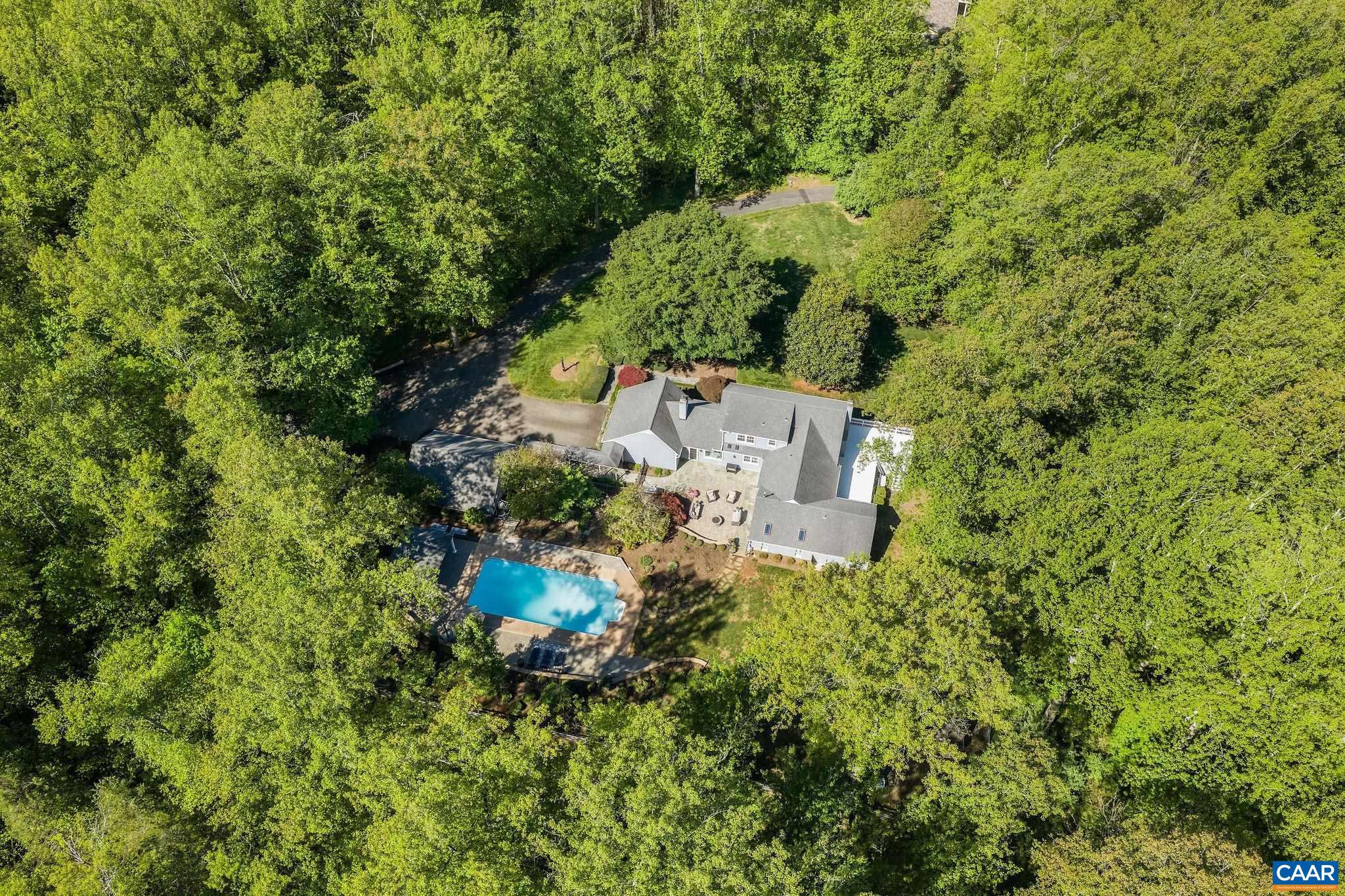 Tucked away on a quiet cul-de-sac, this private sanctuary offers the perfect blend of comfort, style, and accessibility?just minutes from the airport, UVA, fine dining, shopping, and downtown Charlottesville. Designed with entertaining in mind, the home features spacious gathering areas both inside and out, seamless indoor-outdoor flow, saltwater pool surrounded by lush landscaping, and an emphasis on drought-resistant plants to create a peaceful and low-maintenance outdoor oasis.  Owners have spared no expense in transforming this wonderful home with thoughtful finishes and quality craftsmanship throughout. The stunning kitchen, baths, and custom bar were designed by renowned local designer Karen Turner, blending timeless style with everyday functionality.  Other recent updates include a new roof, 4 new heat pumps, a whole house generator, new well pump, new windows, extensive hardscape and landscape, and so much more.  An oversized detached two-car garage adds extra storage and flexibility.  Enjoy the peace and tranquility of the setting along with deeded access to the Rivanna Reservoir?ideal for kayaking, fishing, or simply enjoying nature.  A rare opportunity in one of Charlottesville?s most convenient locations.,Solid Surface Counter,White Cabinets,Fireplace in Family Room,Fireplace in Kitchen,Fireplace in Master Bedroom