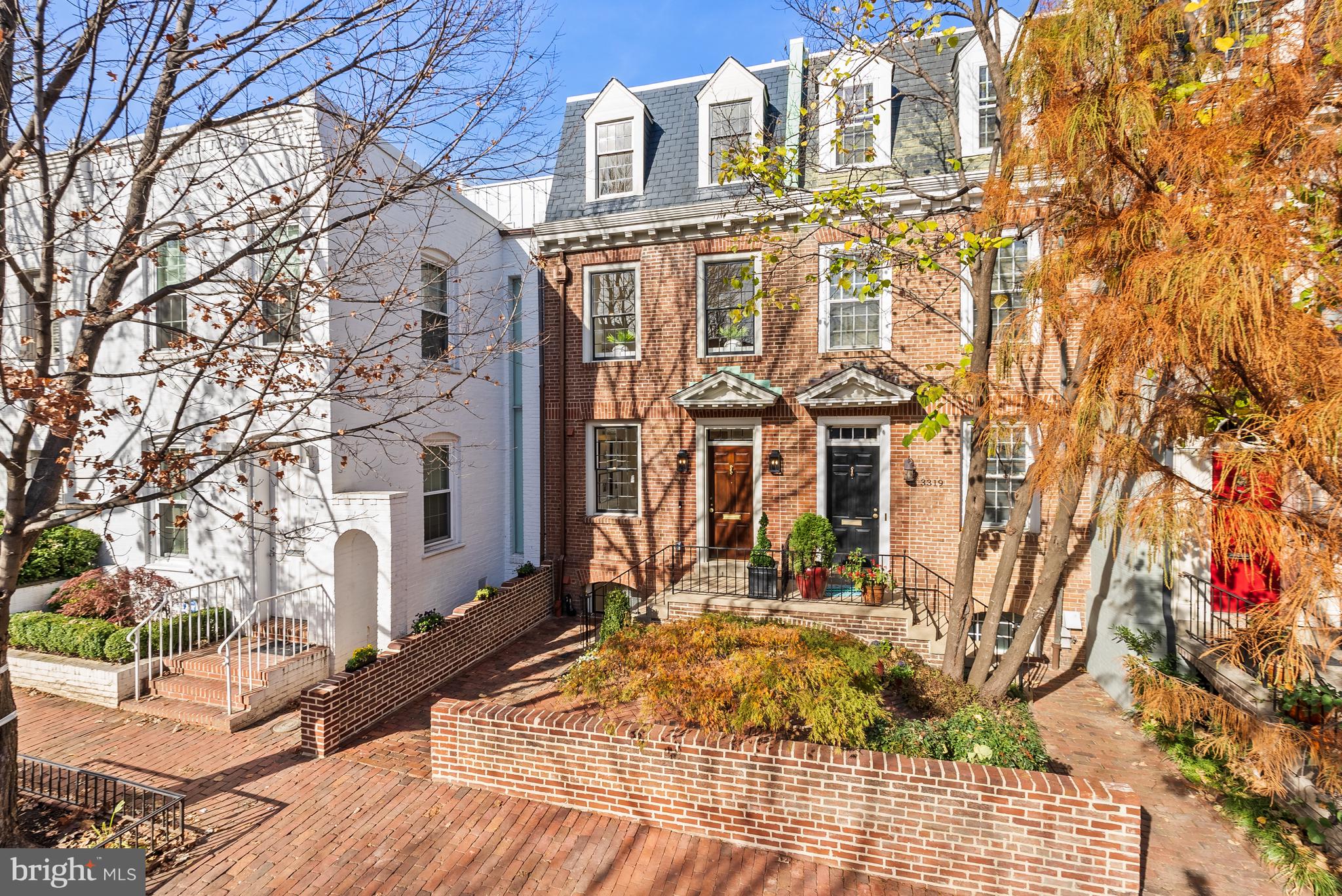 UNDER CONTRACT! OPEN HOUSE CANCELED!  BRAND NEW IN GEORGETOWN WITH ELEVATOR, GORGEOUS GARDENS & GARAGE PARKING! Welcome to 3321 Dent Place where quality and attention to detail takes center stage. Renowned developer District495 in collaboration with Architect Christian Zapatka, paid homage to this traditional and timeless Georgetown neighborhood with elite level finishes that are just as timeless and classic. Originally built in 1948 as one of three colonial revival townhouses in the heart of Georgetown’s West Village, 3321 Dent Place became the first home to the newlywed couple, then Senator John F. Kennedy and Jacqueline Bouvier Kennedy in December of 1953. Christian Zapatka has completely re-imagined the architecture of this storied historically significant property, while transforming it into a highly functional 21st century dwelling. Applying the timeless principles of Beaux Arts planning, a clear and consistent logic for the floor plans was established with a central curvilinear staircase, capped by a skylight, and an elevator that seamlessly connects all four levels of the house. The details throughout this 3,100SF exquisite custom-built 4 Bedroom, 4 Full Bathroom & 2 Half Bathroom home, recall the sophistication and craftsmanship of townhouse architecture in Mayfair, London and the Upper East Side, New York. The ground level of the house presents a proper entrance hall paved in grey and white custom marble. Beyond the central staircase, elevator and powder room, there is a library or guest suite, complete with full bath, walk-in closet and wet bar. The main level of the house, or "piano nobile", epitomizes grace and grandeur with its soaring ten foot ceilings and an elegant drawing room/ dining room. The space is anchored by a stately fireplace, custom millwork, and a wall of meticulously restored vintage windows and doors giving on to a balcony overlooking the deep garden below. A capacious chef's kitchen complete with island and beverage bar, Thermador appliances, ILVE Majestic range, Visual Comfort lighting and Waterworks fixtures offers an inviting space for both cooking and entertaining. The top floor of the house is occupied by a generous primary suite with walk-in-closet and bathroom featuring Waterworks fixtures & Visual Comfort lighting, a laundry closet and an extra bedroom or office with separate bathroom and closet. The lower level of the house provides a full guest suite with bathroom and walk-in closet, along with a home office or wellness space, full laundry room and a wine storage area.  Retreat through the deep garden to the garage that doubles as a garden pavilion with beautiful glass french doors, designer overhead light fixture and EV charger. The quality of execution at 3321 Dent Place is just a notch above all, and deserves to be seen in person. Everywhere you look there is an item of distinction and value. Don’t miss out on this rare opportunity to own a piece of history in the Nation’s Capital.