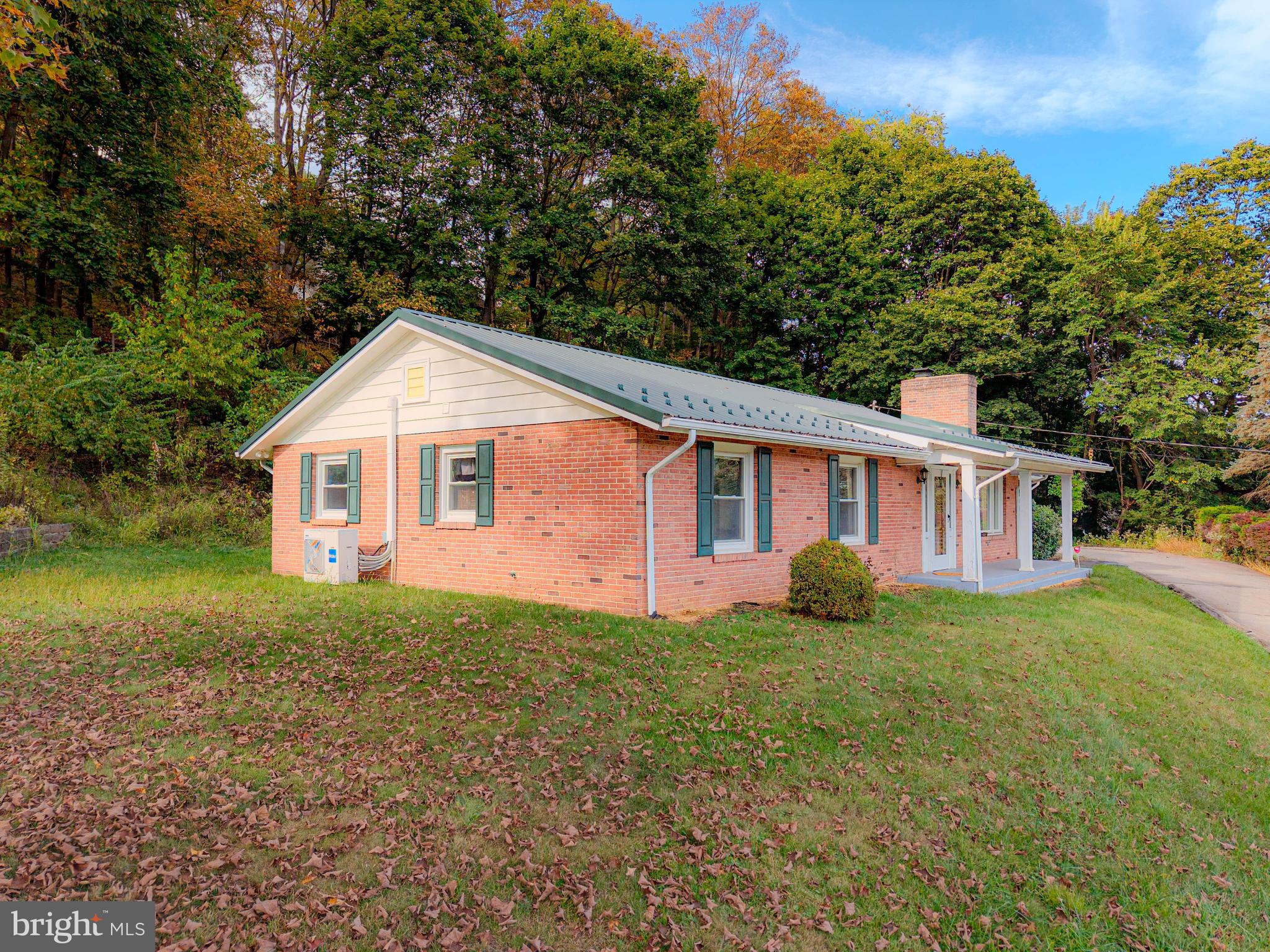 Fall in love with this charming brick ranch home in Bedford Borough, conveniently located near all downtown amenities! This home boasts 3 spacious bedrooms, 2 full bath, and 2 half bath. Enjoy the large living areas with updates throughout, including a formal dining room that flows into a cozy living room with a fireplace. The large front window fills the space with natural light, offering beautiful views. The stylish kitchen features updated appliances, and a bonus room with a pellet stove provides extra space to make your own. The laundry room includes a washer and dryer for your convenience. Relax on the covered front porch and take in the great views in the heart of Bedford. Get ready to schedule your next gatherings on your own rear patio. The property also includes a large 2-car garage, private driveway, and a peaceful yet in-town setting. This home is ready for its new owners to move in and enjoy 680 Barclay Drive!