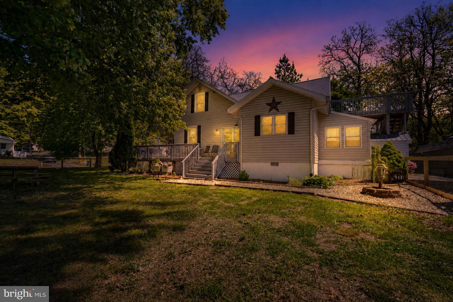 Welcome home to this charming 1925 bungalow sitting on 1.87 acres with the perfect mix of character and updates! Outside, you’ll love the new fenced yard, oversized driveway, and detached 1-car garage with plenty of room for parking, hobbies, or storage. Inside, the home is full of warm and inviting spaces, including a mudroom, main-level laundry, and an updated kitchen with freshly painted cabinets, butcher block countertops, and stainless steel appliances. The large dining room is great for gatherings and opens to the deck through beautiful French doors. The main level also features two bedrooms, a full bath, a cozy living room with a wood stove, and a private office with French doors. Upstairs, you’ll find two more bedrooms, including a spacious primary suite with its own private deck, a large cedar closet, and a roomy bathroom with a jacuzzi tub and separate shower. Need storage? The unfinished basement has plenty of space for all your extras. Major updates have already been done too, including the roof (2023), hot water heater (2023), HVAC (2021), windows (2022), and updated well (2024). If you’ve been looking for a home with charm, space, and modern updates, this one checks all the boxes!