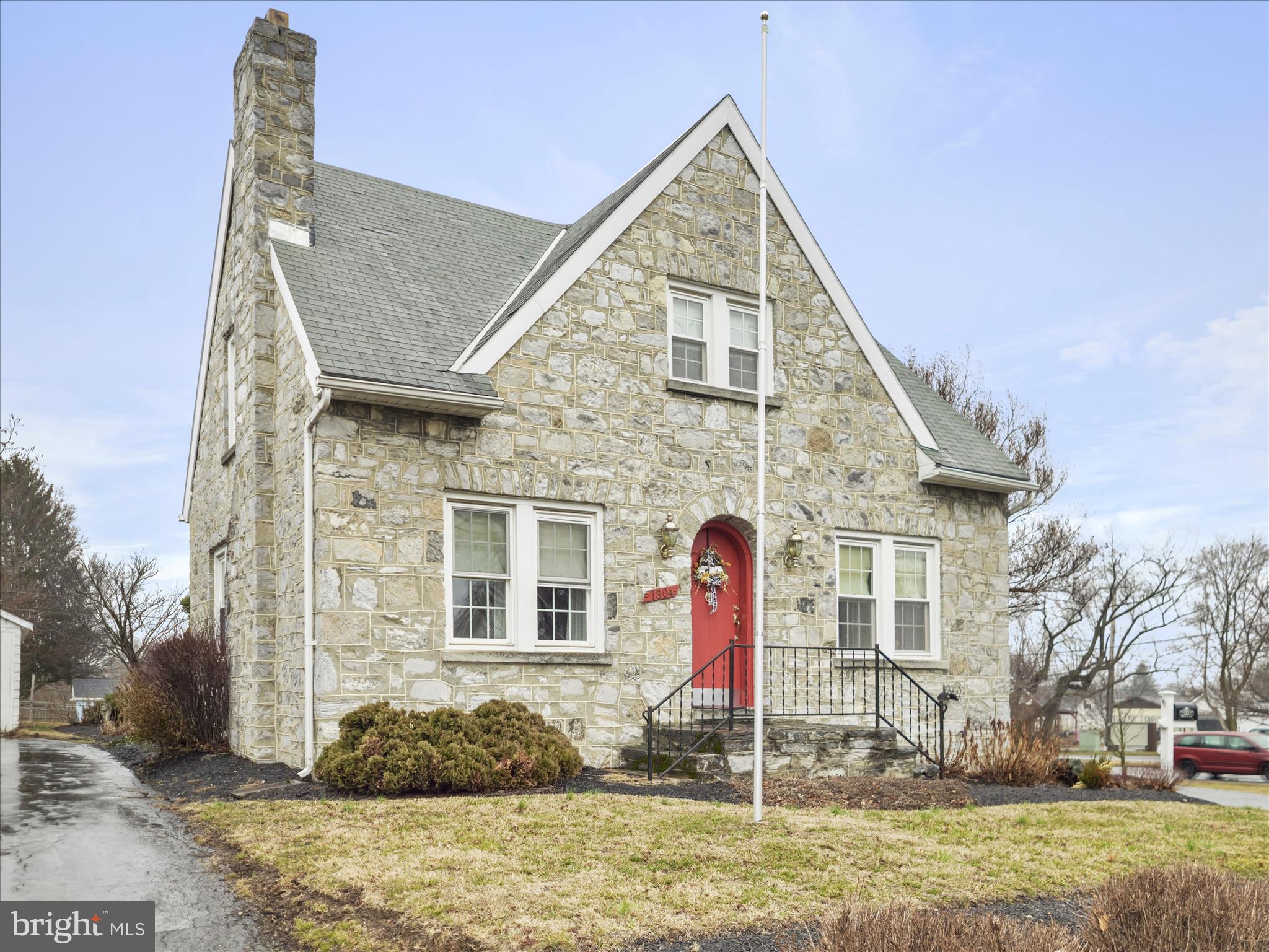 Contract fell through by no fault of seller and now has a brand new roof! Charming, rare and one-of-a-kind gem truly describes this home! An enchanting stone cape cod offering  so much including an EXTRA lot (possibly buildable, buyer to verify -  Tax ID 2225000382 - see tax record for taxes) and on a street corner! Inside you'll find gleaming hardwood floors and a very functional layout featuring a kitchen with upgraded countertops and breakfast bar, separate dining room, living room with wood burning fireplace and a mud room off the kitchen leading to the  rear. Upstairs you find two very spacious bedrooms, both with two closets, and a full bath with tiled shower. You'll surely enjoy the outside ambiance of the deck, patio and spacious yard that includes the extra lot allowing you to enjoy plenty of space for recreation and even possibly the gain from the investment aspect of it. There's plenty of storage with a full basement with laundry area and double sink, and a large detached garage right off the alley. Your home sweet home awaits so schedule your showing now!