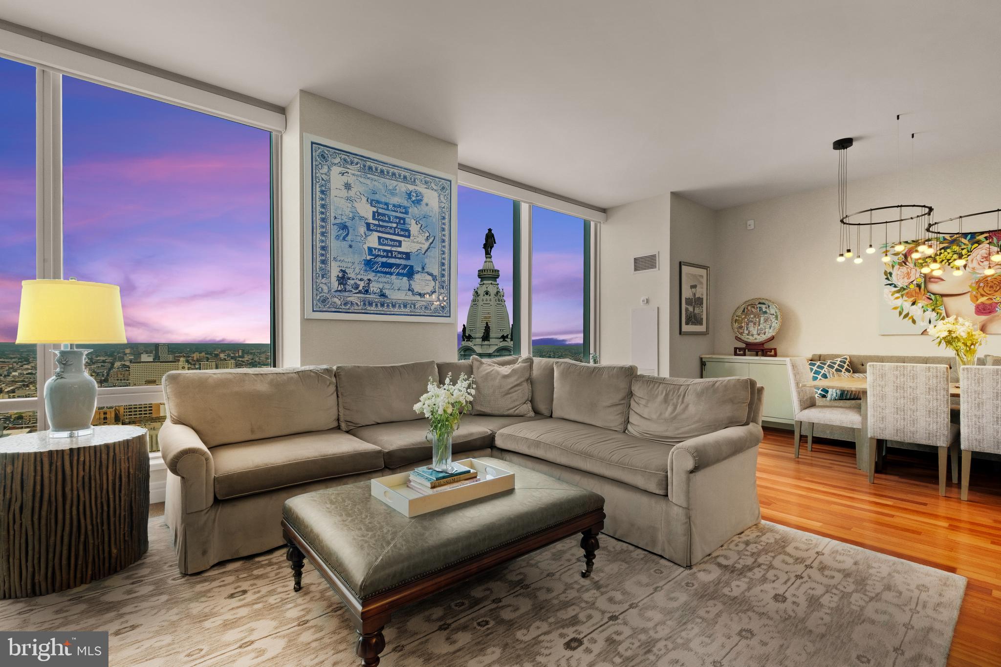 Experience unmatched luxury living in this expansive 2,115 sq. ft. residence with breathtaking open city views at the Ritz Carlton Residences. A grand entry foyer welcomes you into the home defined by soaring 10-foot ceilings, floor-to-ceiling windows, and incredible natural light throughout.  At the heart of the home is an open chef’s kitchen featuring stainless steel appliances, quartz countertops, and abundant storage, flowing seamlessly into a large living area with a built-in media center and a dining room ideal for large gatherings. The thoughtfully designed split two-bedroom layout ensures privacy and flexibility, perfect for both everyday living and entertaining. The primary suite is a true retreat, with dual walk-in closets fully customized and built out for optimal organization. Indulge in the rare luxury of his-and-hers separate bathrooms, each adorned with marble tiling, polished chrome hardware, and sophisticated finishes. The second bedroom, currently shown as a den space can easily be used as a true bedroom space and is complete with a large closet and en-suite bath. Every detail in this residence blends elegance with functionality, offering an unmatched living experience in the heart of the city.  Additional features include an extra-large laundry room with storage, Lutron electric shades, and central heating and cooling, and 1 parking space. The world class Residences at the Ritz amenities include a 24 hour doorman and concierge, valet parking, town car services, fitness center, indoor swimming pool with a jacuzzi, private locker rooms and yoga area, as well as a theatre room, outdoor entertaining area with a kitchen area, resident lounge, and dog park.