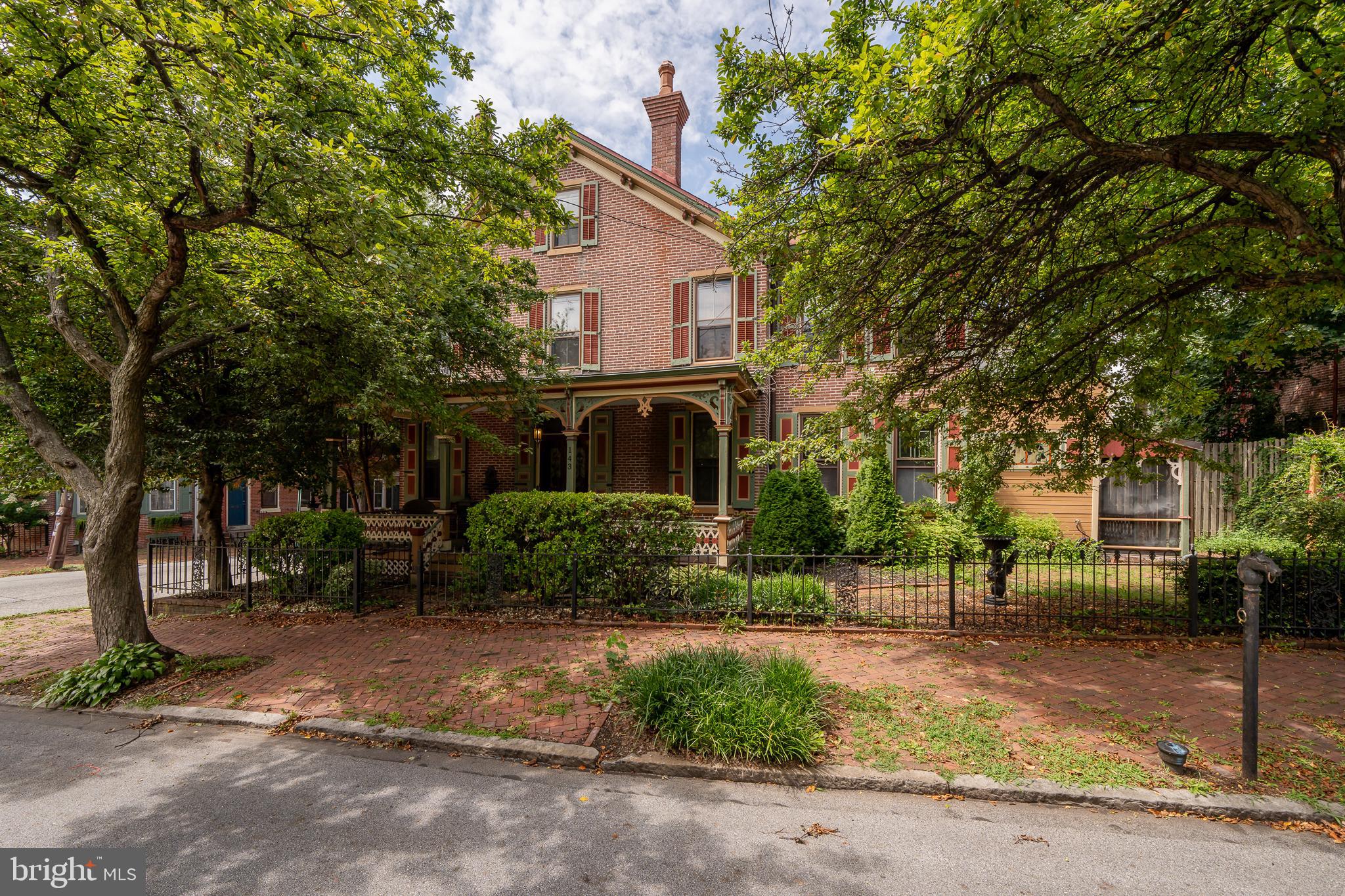 This Victorian  twin is a step back in time to enjoy the old-style charm of this home. Custom wood blinds, refinished floors, and wood trim throughout the house. Stain glass windows, charming & welcoming front porch, fenced-in yard, stainless steel appliances, granite countertops, features 4 bedrooms 2.5 baths, and basement provides plenty of storage space. Also included in this property is a detached 2-car garage a short walk away located at 425 S. Darlington Street. 24-hour notice for Showings. A short walk to all the downtown of West Chester amenities. 7 Star HSA Home Warranty provided to the Buyer.