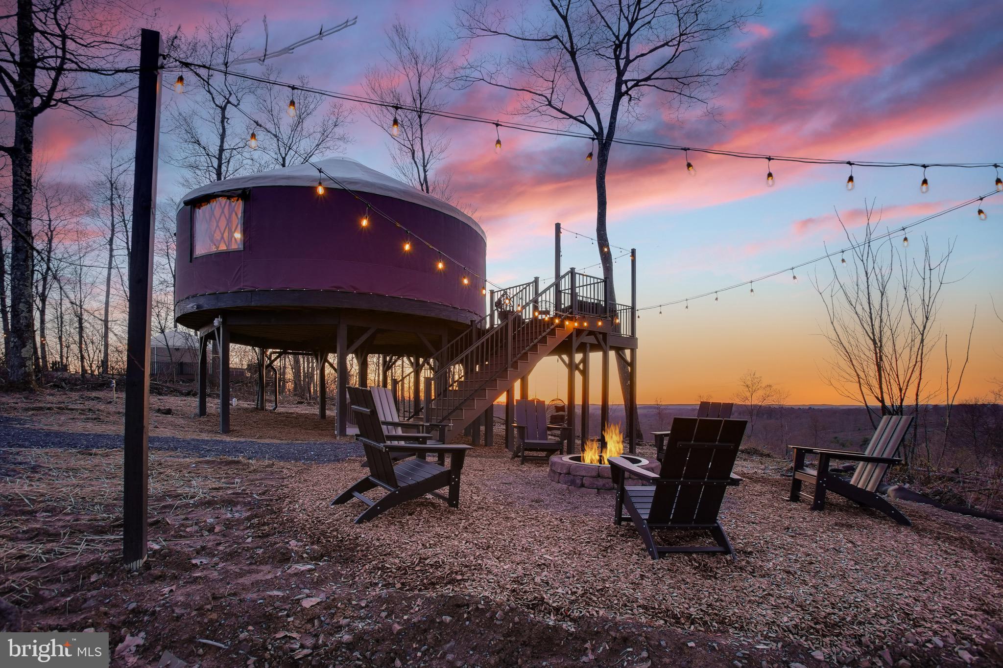 Hundreds of 5-star reviews and a proven operating history make this a rare opportunity to acquire a fully turnkey, boutique hospitality retreat in the heart of the Pennsylvania Wilds. Search “Yurt in Reynoldsville, PA” on Airbnb to experience the guest appeal firsthand. With nearly $245,000 in gross income (and growing) in the last 12 months this is a proven asset, not just based in potential.

Perched atop a beautiful wooded ridgeline overlooking the surrounding forests and farmland, guests love the breathtaking panoramic views, peaceful solitude, hot tubs, hiking access, and exceptionally dark skies ideal for stargazing. Unique features including the signature “stargazing loft” bubble domes have helped create a memorable guest experience that drives strong reviews and repeat visitation.

Surrounded by some of the most scenic recreation in Western Pennsylvania, the property offers guests convenient access to a wide variety of outdoor attractions. Nearby highlights include the expansive Cook Forest State Park, known for its towering old-growth forests, hiking trails, kayaking, and scenic overlooks; Clear Creek State Park with its beautiful river valleys and wildlife viewing; and the renowned elk viewing areas near Benezette, where visitors travel from across the Northeast to experience Pennsylvania’s famous elk herd. The region also offers abundant ATV and off-road riding opportunities, horseback riding, fishing, hunting, boating, and miles of hiking through the forests and rolling hills of the PA Wilds. Seasonal attractions including fall foliage, stargazing, and winter recreation further support year-round guest appeal.

The property is offered fully turnkey, with excellent, experienced professional management, cleaning, and maintenance teams already in place and eager to continue operations for a new owner, allowing for a smooth operational transition from day one. 

Situated on 20+ acres of beautiful woodland, the property offers substantial room for future expansion with additional yurts, cabins, wellness amenities, event spaces, or other experiential hospitality concepts. The 4 existing yurts occupy only a small portion of the 20+ acres available. Beyond the business opportunity, the land itself provides outstanding recreational use including hiking, wildlife enjoyment, ATV use, hunting, and private enjoyment of the natural setting.

Despite the peaceful and secluded atmosphere, the property remains conveniently located approximately 20 minutes from charming downtown Brookville, offering guests easy access to restaurants, shopping, and regional attractions while still feeling completely immersed in nature. Take this opportunity while its available!