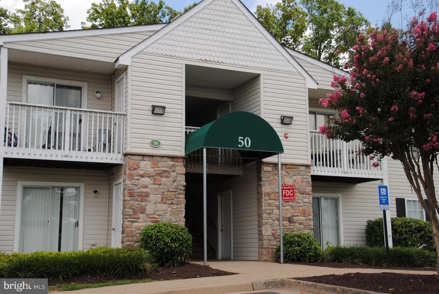 Beautiful condo on 2nd Level with Family Room, Dining Area, 2 Bedrooms, 2 full Baths, Galley Kitchen with Stainless Steel Appliances, upscale fixtures, Corian counter tops & nice cabinetry.  Upgraded Luxury Vinyl Plank flooring in  Living Room, Dining  area, and hallway.  New stackable washer and dryer in unit.  Balcony / deck upgraded to trek-type material,  Rent includes trash.  While sitting on your balcony, enjoy the view of trees (not the parking lot). Also included are community pool,  gym. Close to I-95, VRE, Quantico, commuter lot, shopping & storage room off the balcony. Available Now !! *NON-Smoking & NO PETS* Security Deposit $1905. *Must have Good Credit, Good Rental History & Verifiable Income. Renters Insurance will be required. You can apply online at www.suncompanies.biz. Tenant required to pay $105 / mo  for electric and water.