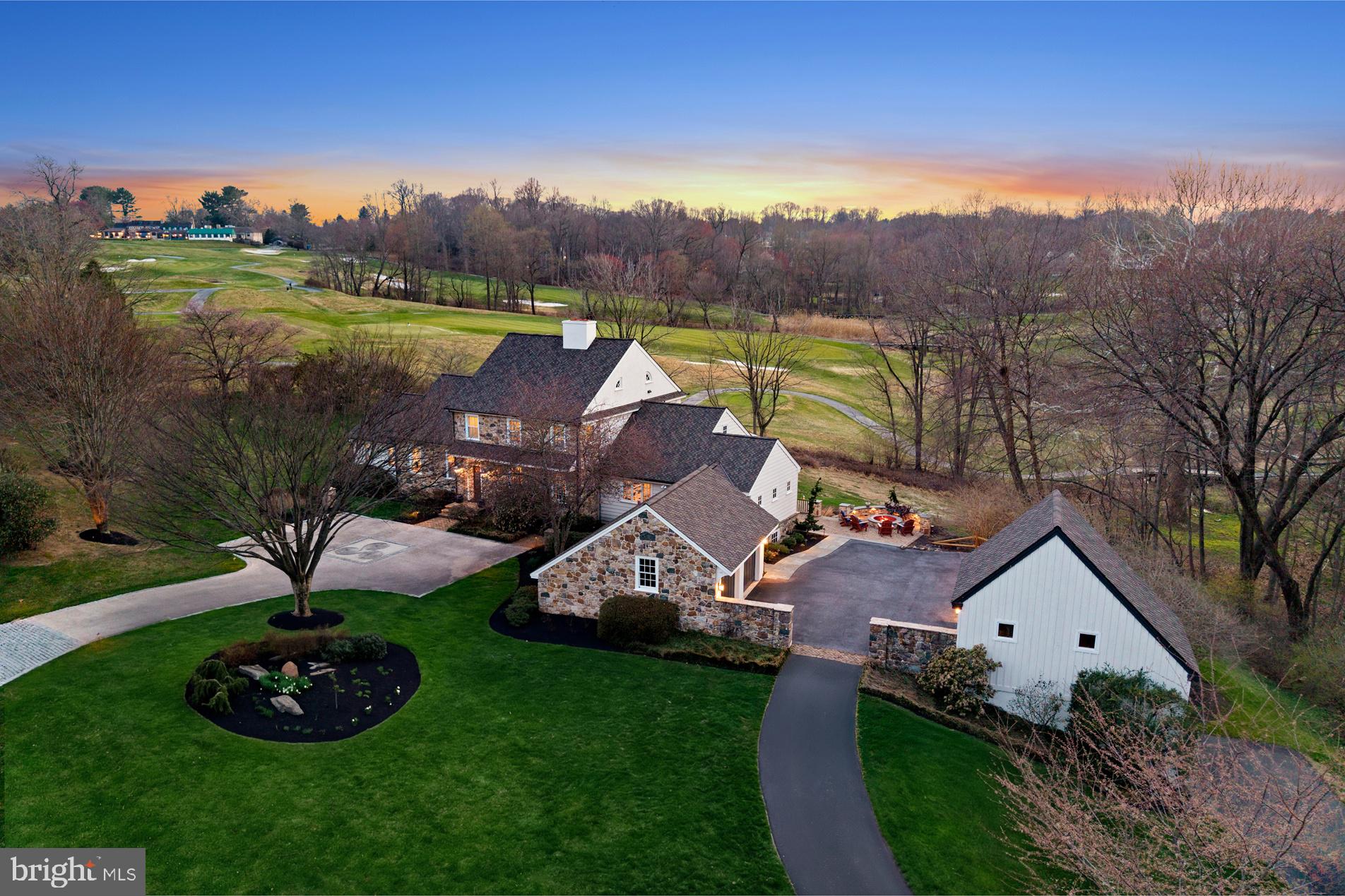 Set within the rolling hills of Chester County and tucked into one of Hartefeld’s most private enclaves, 100 Pyles Mountain Lane is a rare offering where architecture, craftsmanship, and lifestyle come together seamlessly.

Designed by the renowned Bernardon architects, this custom-built home was thoughtfully created to reflect the charm and authenticity of a 19th-century Pennsylvania farmhouse all while delivering the modern layout and amenities today’s buyers expect.

Positioned on 1.3 acres it's one of the largest and most private lots in the community. The property captures sweeping fairway views and a sense of tranquility.

Inside, timeless details take center stage. Reclaimed random-width pine floors, rich millwork, paneled walls, and period-inspired mantels create warmth and character throughout. The expansive kitchen is both functional and refined, featuring Viking and SubZero appliances, while the adjacent living spaces are designed for both everyday living and effortless entertaining. A first-floor primary suite is set within its own private wing, complemented by a dedicated home office and beautifully curated gathering spaces that flow seamlessly to the outdoors.

The walkout lower level with 10-foot ceilings, brick flooring, it's own kitchen, bath, and open living space offers incredible flexibility for guests, extended stays, or entertaining. Upstairs, three generously sized bedrooms and two full baths provide ample space for family and visitors alike.

Outside, the lifestyle truly unfolds. A screened porch, expansive hardscaping, and an elevated fire pit create the perfect setting to take in sunset views over the fairway. A detached two-story barn has been thoughtfully reimagined as a sophisticated recreational space that is ideal for hosting, unwinding, or creating your own retreat.

Enjoy peace of mind with a brand-new 50-year, triple-layer roof, updated HVAC, refinished floors, and fresh paint throughout—allowing you to simply move in and start enjoying your new home.

Life in Hartefeld National Golf Club extends far beyond the home itself. This offering includes a one-year social membership, providing access to the clubhouse, dining, events, and rounds of golf,  bringing a true country club lifestyle right to your doorstep.

This is more than a home - it’s a setting, a lifestyle, and a level of design rarely available in Hartefeld. This is Chester County living at it's finest.