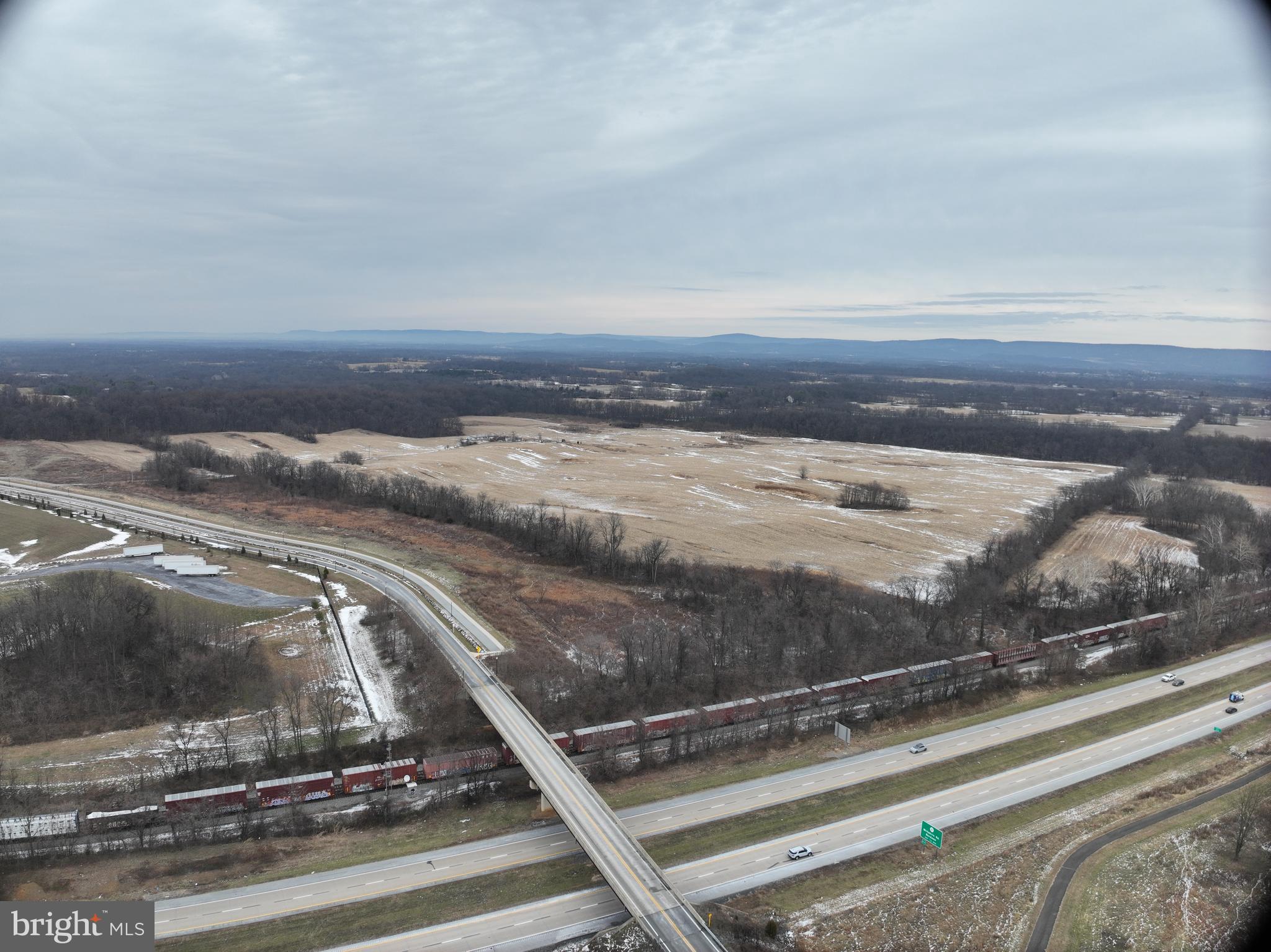 Discover an exceptional opportunity to own 194.48 acres of flat, partially cleared land in one of Jefferson County’s most strategic and rapidly growing corridors. Ideally positioned for industrial, commercial, or large-scale development, this expansive property offers unmatched accessibility, visibility, and long-term investment potential.
Located just moments from Route 9 with convenient connections to Rt. 480, Charles Town Road, and surrounding regional arteries, this site is perfectly situated for transportation, logistics, and workforce operations. The property also benefits from close proximity to key community and industrial anchors including the B&O Railroad, North Jefferson Elementary, and major employer Rockwool.
With public utilities available, infrastructure is already aligned to support development. The land’s flat topography and partially cleared landscape make it ideal for large footprints, staging, warehousing, industrial complexes, or future subdivision.
A partially paved, mostly gravel access road leads to the tract via Granny Smith Lane, ensuring smooth ingress and egress for equipment, trucks, and future operations.