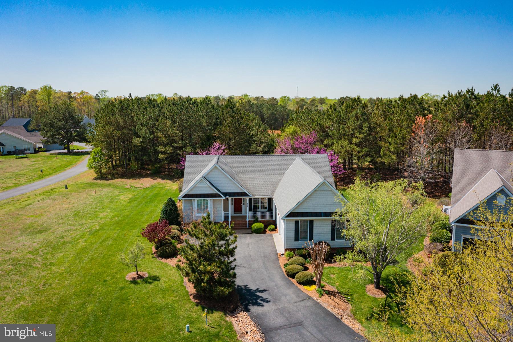 Maintenance free, one level living with a fabulous floor plan in the sought after community of Hills Quarter! This home boasts an entry foyer opening to a living room with vaulted ceiling and gas fireplace and a separate dining room. The large eat-in kitchen and breakfast area overlook a landscaped, private back yard and provide access to a lovely three season room. The large primary suite, which comprises the left side of the home, includes 2 walk-in closets and an ensuite bath with 2 vanities, jetted tub and separate shower. The right side of the home includes two well-sized bedrooms, a full hall bath and a separate laundry room leading to a 2 car garage. This home is move-in ready, offering not just a property but a community with amenites to include a pool, clubhouse, tennis courts, walking trails, lawn maintenance and trash pickup!