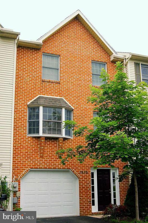 Welcome home to this newly remodeled (this year), beautifully maintained three-story interior townhouse offering approximately 1,700 square feet of comfortable living space in a peaceful rural setting.  With no homes directly behind the property, you’ll enjoy added privacy and open views from both the deck and backyard.  The entry level features a spacious family room or flex living area, a convenient half bath, and direct access to the backyard through a patio door. The backyard creates an inviting outdoor space for relaxing, entertaining, or enjoying the surrounding scenery.  The main living level offers an open and functional layout with a bright living room, dining area, kitchen, and an additional half bath. Step outside to the rear deck overlooking the backyard, offering a peaceful setting for morning coffee, outdoor dining, or simply enjoying the surrounding views  The upper level includes three bedrooms and two full bathrooms, including a comfortable primary suite designed for everyday convenience.  Combining generous living space, multiple outdoor entertaining areas, and a desirable location with no rear neighbors, this home offers the perfect blend of comfort, privacy, and value.  Don't miss your opportunity to make this move-in-ready townhouse your next home!
