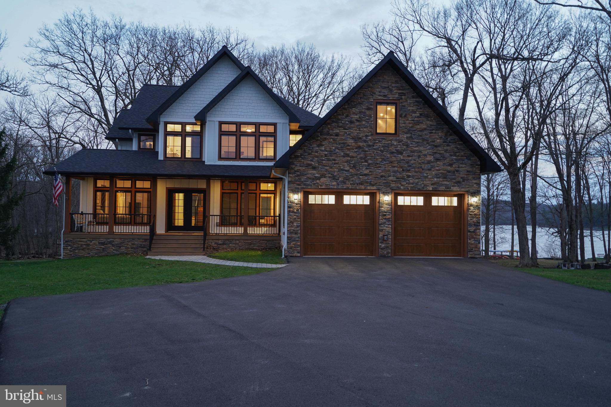 Luxury meets lakefront! 294 Stilwater Drive brings lakefront living to its finest. Located in the Stilwater community, this property offers lake access with a single dock slip at the community dock, just a short distance in front of the home. Offering 7 bedrooms, 6 full and 2 half bathrooms spread over 5800+ square feet of finished living space, this home was built to entertain guests, host your favorite events or enjoy the serenity of the lake glistening from the porch.  Recently built in 2025 with rental capabilities in mind, this home has all of the necessary short term rental fire suppression and alarm systems to be rented as a 7 bedroom home, something you do not see often. Additionally, the single dock slip for this home is located directly in front of the home with only 3 slips at this dock, giving a more private feel at the lakefront. Sold mostly furnished, this creates a nearly turn-key opportunity for investors, second homeowners and primary residents alike.  If you are truly looking for one of Deep Creek Lake's finest lakefront homes, you have found it at 294 Stilwater Drive!