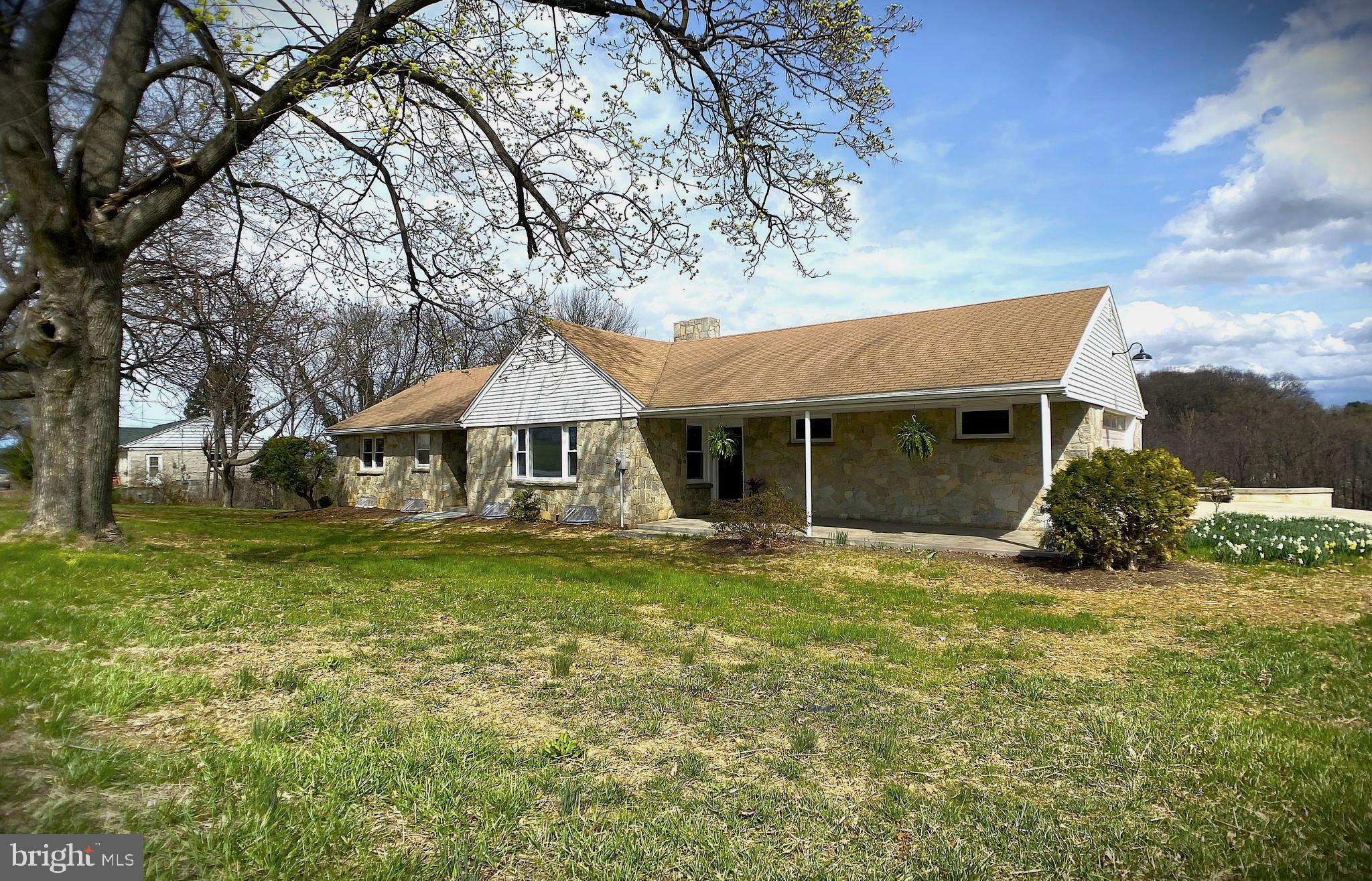 Welcome to this spacious, completely remodeled 3-bedroom, 2-bathroom stone ranch house, beautifully nestled in the peaceful Windsor Township York County. This home features a modern open floor plan, seamlessly combining the kitchen, dining room, and living room to create a bright and inviting space ideal for comfortable living and entertaining. The generous living room is perfect for gatherings, with plenty of room for seating and a large, stunning stone walk-around fireplace that adds both warmth and charm to the atmosphere. You'll appreciate the brand new kitchen and appliances with plenty of quartz counter space for all thee cooking or baking you desire. 
The finished basement is a versatile space that could easily serve as an in-law suite, offering a second kitchen, another full bathroom, a huge family room for all the holiday gatherings  with a second stone fireplace , laundry room w /front load washer and dryer included, and a huge bonus room located under the garage which could easily be converted to your own personal gym or work shop. The walk-out basement leads directly to the lower-level patio, providing easy access to the expansive rear yard where you can enjoy breathtaking sunsets and sunrises, or watch local wildlife like deer and turkey roam through the serene surroundings.
This home also boasts a large 2-car garage with a full attic above, offering additional storage. With an abundance of finished square footage, storage space, and workspace, you’ll have everything you need right at your fingertips. The newly paved driveway ensures smooth and easy access to the garage, making daily life even more convenient.
Located in a quiet and tranquil neighborhood, this property offers the perfect balance of peaceful living with easy access to nearby cities like York, Lancaster, and even Maryland. Whether you're enjoying a quiet evening by the fire or taking in the views from your patio, this remodeled stone ranch house offers a wonderful blend of comfort, functionality, and natural beauty. Don't miss the chance to make this unique property your new home!