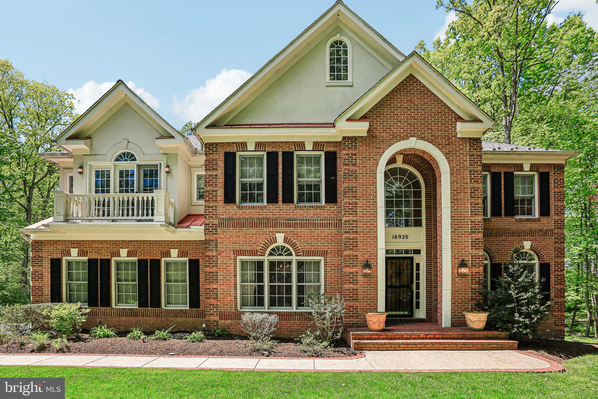 Set on a picturesque, wooded 1.25 acres in sought-after Howard County, this exceptional brick luxury home offers over 6,000 square feet of refined living space, seamlessly blending elegance with modern comfort. A stately façade and manicured grounds create a grand first impression, leading into a light-filled interior highlighted by high ceilings, rich hardwood flooring, and wonderful architectural details throughout. The two-story family room is anchored by a stunning floor-to-ceiling brick fireplace and framed by expansive windows that capture serene wooded views in every season.
At the heart of the home, the gourmet kitchen is designed for both everyday living and entertaining, featuring custom cabinetry, expansive granite countertops, a large center island with seating, and an open flow into the main living areas. The home offers generously sized bedrooms and 4.5 baths, including a luxurious primary suite, with separate sitting area.  Complete with a spa-inspired bath showcasing a glass-enclosed shower, soaking tub, and dual vanities. Upstairs, an open overlook adds to the home’s open feel, while the lower level provides additional versatile living space ideal for recreation, a home gym, or guest accommodations. Outside, the private, tree-lined setting creates a peaceful retreat, perfect for relaxing or entertaining on the deck while enjoying nature views year-round. Complete with a two-car garage, over 6,200 total square feet, and located within beautiful Howard County, this home offers an unparalleled combination of space, privacy, and elegance—just moments from major commuter routes, shopping, and dining