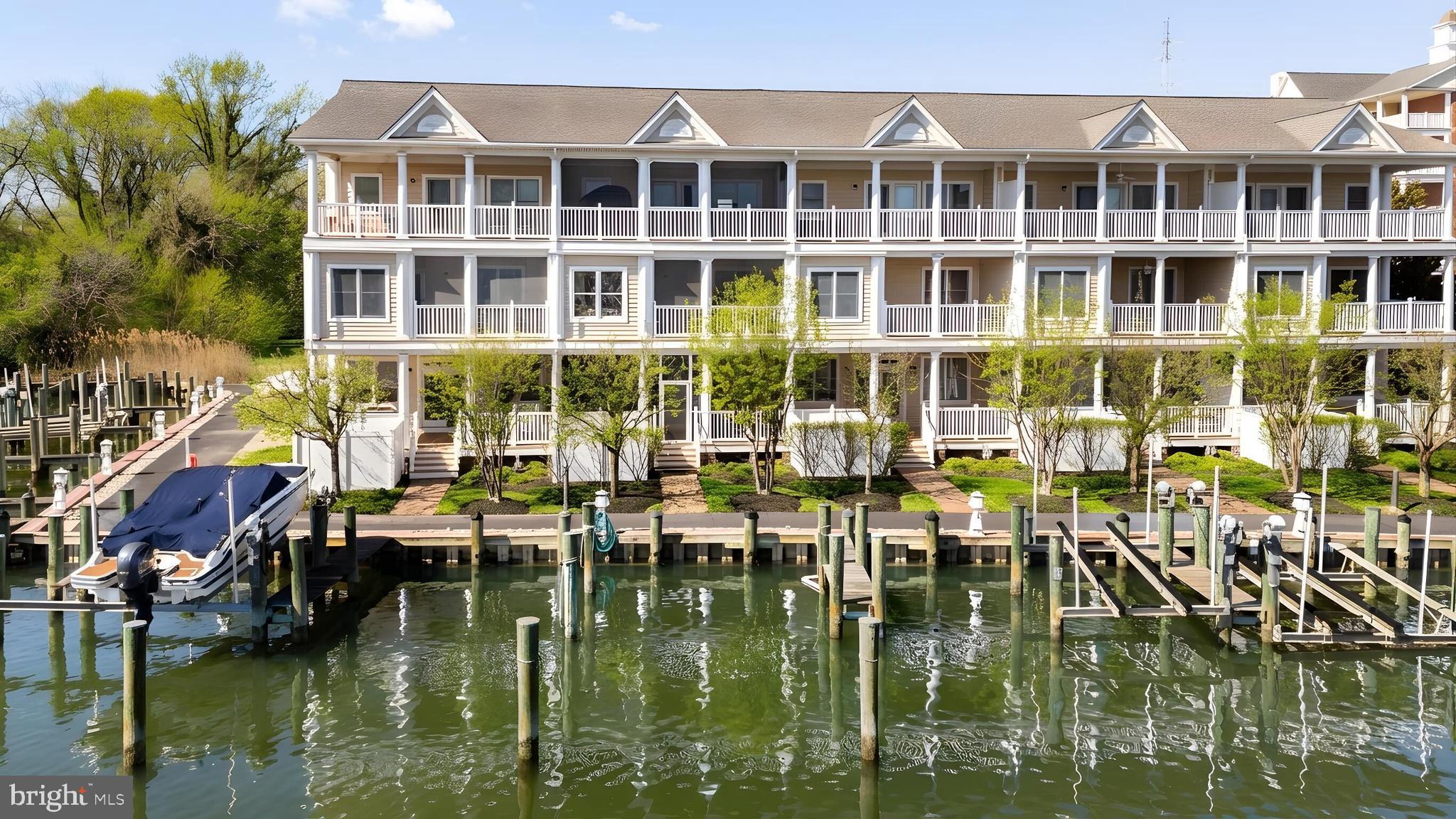 Waterfront Living with Boat Slip in Waterside on Cambridge Creek!
Enjoy sweeping water views, three screened porches/decks and a deeded deep-water boat slip in this spacious three-level residence designed for easy Eastern Shore living. Offering approximately 3,000 square feet per floor plans, the home combines the comfort of a single-family lifestyle with low-maintenance convenience.
The main level features open living and dining spaces filled with natural light, along with a well-appointed kitchen offering granite countertops, stainless steel appliances, island seating and generous storage. A screened waterside porch extends the living space and invites relaxed indoor-outdoor entertaining.

The entry level includes a flexible family room with full bath and private screened porch, ideal for guests, recreation or home office use. Upstairs, the waterside primary suite offers vaulted ceilings, a large walk-in closet, spacious bath and private screened porch, plus an adjoining office or studio nook.

Just blocks from downtown Cambridge’s dining, shops and marina district, this is an exceptional full-time residence or lock-and-leave getaway with direct access to Cambridge Creek and the Choptank River. Square footage based on floor plans. Tax record may differ and buyers should verify.