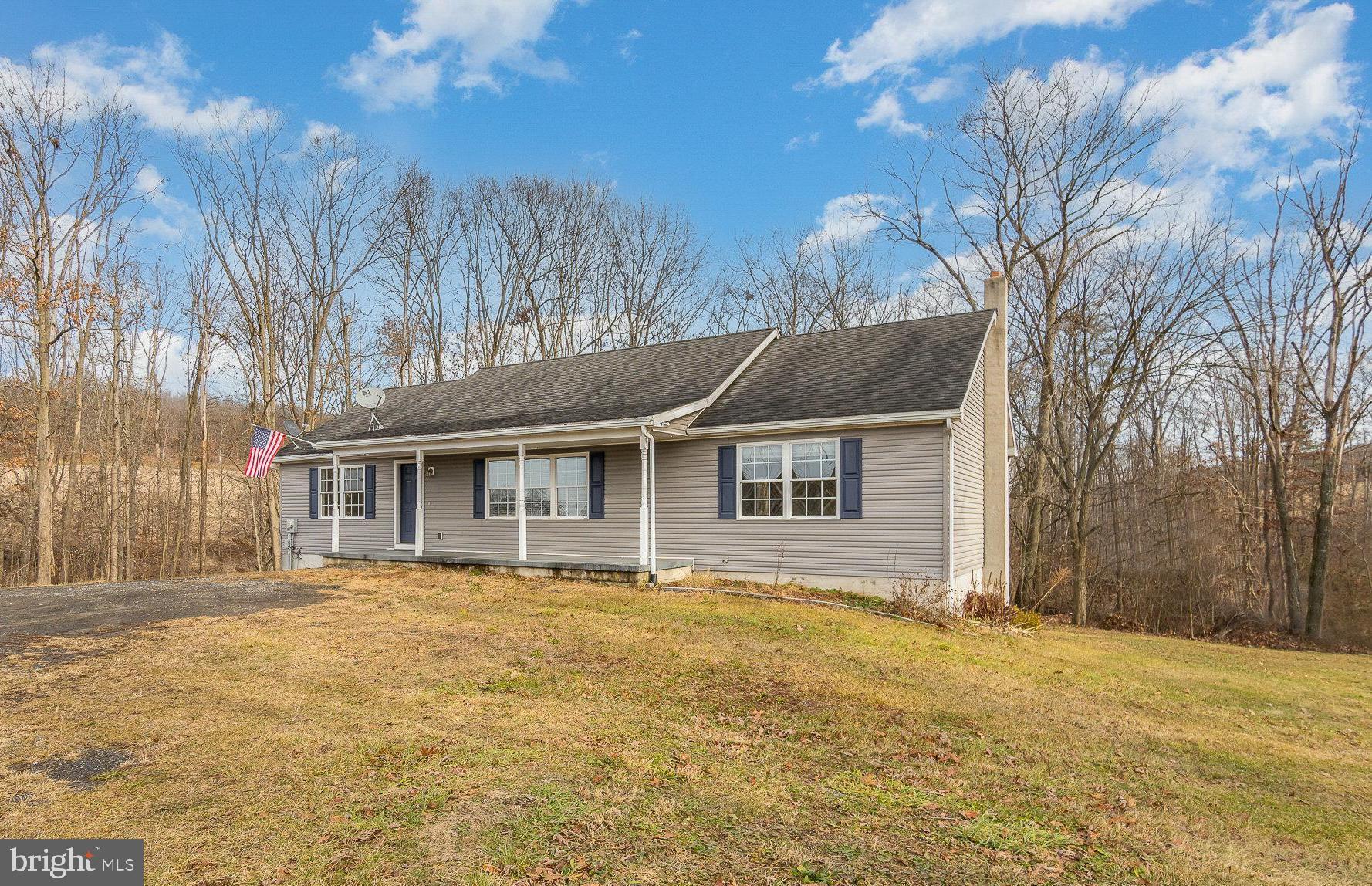 Welcome to this well cared for ranch-style home nestled on over 2 acres of serene landscape with a picturesque wooded backdrop. Offering 1,539 square feet of comfortable living space, this delightful residence built in 2008 offers a perfect blend of tranquility and modern convenience.  As you step inside, you'll be greeted by a freshly painted interior that exudes a warm and inviting atmosphere. The main living area features an open layout, creating a seamless flow between the living room &  dining space opening to the spacious crisp white kitchen with ample cabinetry and counterspace.  A large pantry and laundry room  is conveniently located off of the kitchen.  This home features 3 sizable bedrooms, including a spacious primary bedroom with large walk-in closet & ensuite  bathroom complete with a corner soaking tub, perfect for unwinding after a long day, as well as a separate shower & linen closet.  A full walkout basement awaits your personal touch and offers ample space for storage or the potential to create additional living areas.  The lower level & garage are fully conditioned spaces with ductless mini-split systems,  as well as a wood stove.   Many recent upgrades including newer HVAC, freshly painted, newer solid surface flooring, and so much more! Beautifully situated on over 2 acres, you will enjoy the  expansive lawn space enveloped by the peaceful wooded backdrop  with a lovely stream running through.  Located in Greenwood School District  & Conveniently just 10 minutes to Route 15!