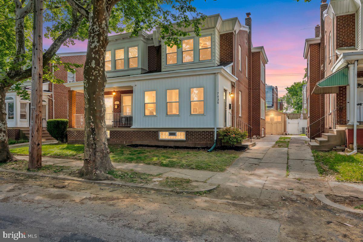 Welcome to this stunningly renovated twin-style home, perfectly blending modern upgrades with classic charm. This beautifully remodeled 3 bedroom, 1 .5  bath twin style home offers over 1,440 sq. ft. of living space, a massive lower level, and a private rear deck, fenced in yard, and  driveway with parking. Tucked away on a quiet one-way, tree-lined street, this home welcomes you through an enclosed sun porch featuring a brick accent wall and 3 oversized windows that fill the first floor with natural light. Inside, you’ll find a bright and spacious living room with crown molding, gorgeous luxury vinyl plank flooring throughout, brick faux fireplace, freshly painted t/o, and an open, flowing floor plan. The large formal dining room is ideal for entertaining, while the modern kitchen offers the perfect balance of style and function with abundant cabinetry, built-in appliances, exquisite marble style backsplash, granite countertops, garbage disposal, ceiling fan light fixture and access to the covered rear porch that leads to the private, fully fenced backyard and shed. Upstairs features 3 generous sized bedrooms, each with ceiling fan light fixtures/ overhead lighting, and ample closet space, along with an updated 3-piece hallway bathroom showcasing striking ceramic tile in the shower. The massive lower level offers endless possibilities and can be easily finished to suit your needs as a family room, rec room, home office, gym, or possibly even a 4th bedroom. It also features a rear egress door that provides direct walk-out access to the backyard, adding both convenience and functionality.  Additional highlights include a covered rear porch, fenced backyard perfect for summer barbecues, large shed,  and close proximity to schools, shopping, public transportation, and major highways. Don’t miss your chance to own this beautifully updated home with timeless charm in a peaceful neighborhood. Schedule your showing today!