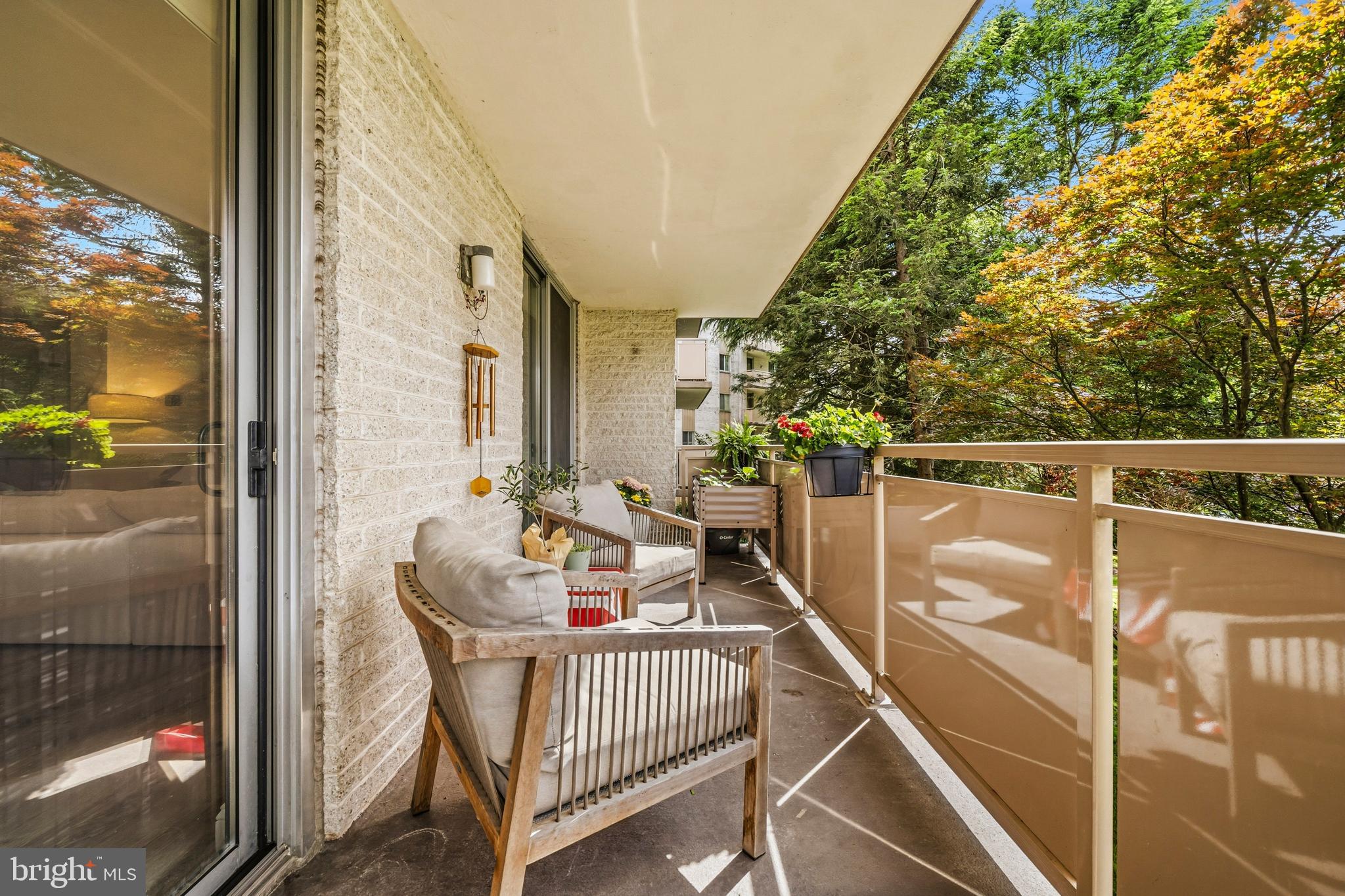 ​Above-ground 2-bedroom, 1-bath condo with an elevated balcony positioned above surrounding walkways and pedestrian traffic. Automated window shades on floor-to-ceiling sliding doors, LVP flooring, professional paint, updated fixtures, and a renovated bath. Kitchen includes LG appliances installed in 2022 and a double electric oven. Secure, accessible unit, additional storage on the 5th floor (penthouse storage), indoor bike storage, exterior bike racks, adjacent to Cabin John Park Trailheads and Nature Center. Deeded garage parking #110.  Community amenities include trails, pool , baby pool, tennis courts/pickle ball, grills, picnic areas, movie nights, mixers, bingo, and cookouts.