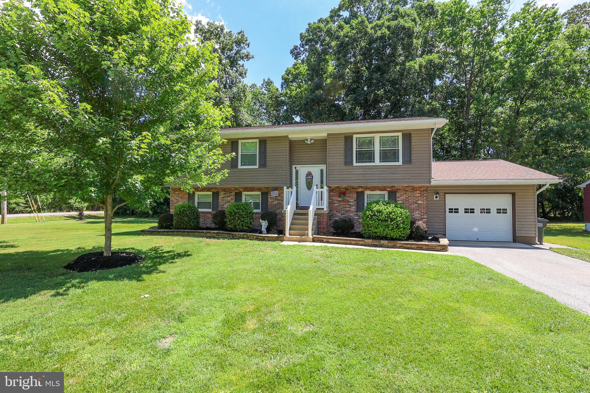 Welcome to 21700 Endeavor Street, a beautifully maintained home tucked away on a quiet street just minutes from NAS Patuxent River. Enjoy the convenience of biking to work while coming home to the peace and privacy of an established neighborhood.

Lovingly cared for by the same owners for more than 30 years, this home showcases true pride of ownership throughout. The thoughtfully updated kitchen opens to the main living area, creating a bright and inviting space perfect for everyday living and entertaining.

The upper level offers three comfortable bedrooms and two full bathrooms, while the lower level features a fourth bedroom and full bath—ideal for guests, multigenerational living, or a private home office. The cozy family room is anchored by a wood-burning stove capable of heating much of the home during the winter months, helping keep utility costs remarkably low.

Outside, you'll find a spacious two-tier deck overlooking a private backyard, providing the perfect setting for summer barbecues, morning coffee, or relaxing evenings outdoors.

Major updates provide peace of mind, including a new roof and paved driveway in 2017, as well as new windows installed in 2018. Residents also enjoy access to a private community beach. 

Move-in ready and meticulously maintained, this is the kind of home buyers hope to find—offering space, comfort, thoughtful updates, and an unbeatable location just moments from Pax River Naval Air Station. Don't miss the opportunity to own a home that has been truly loved and exceptionally cared for.