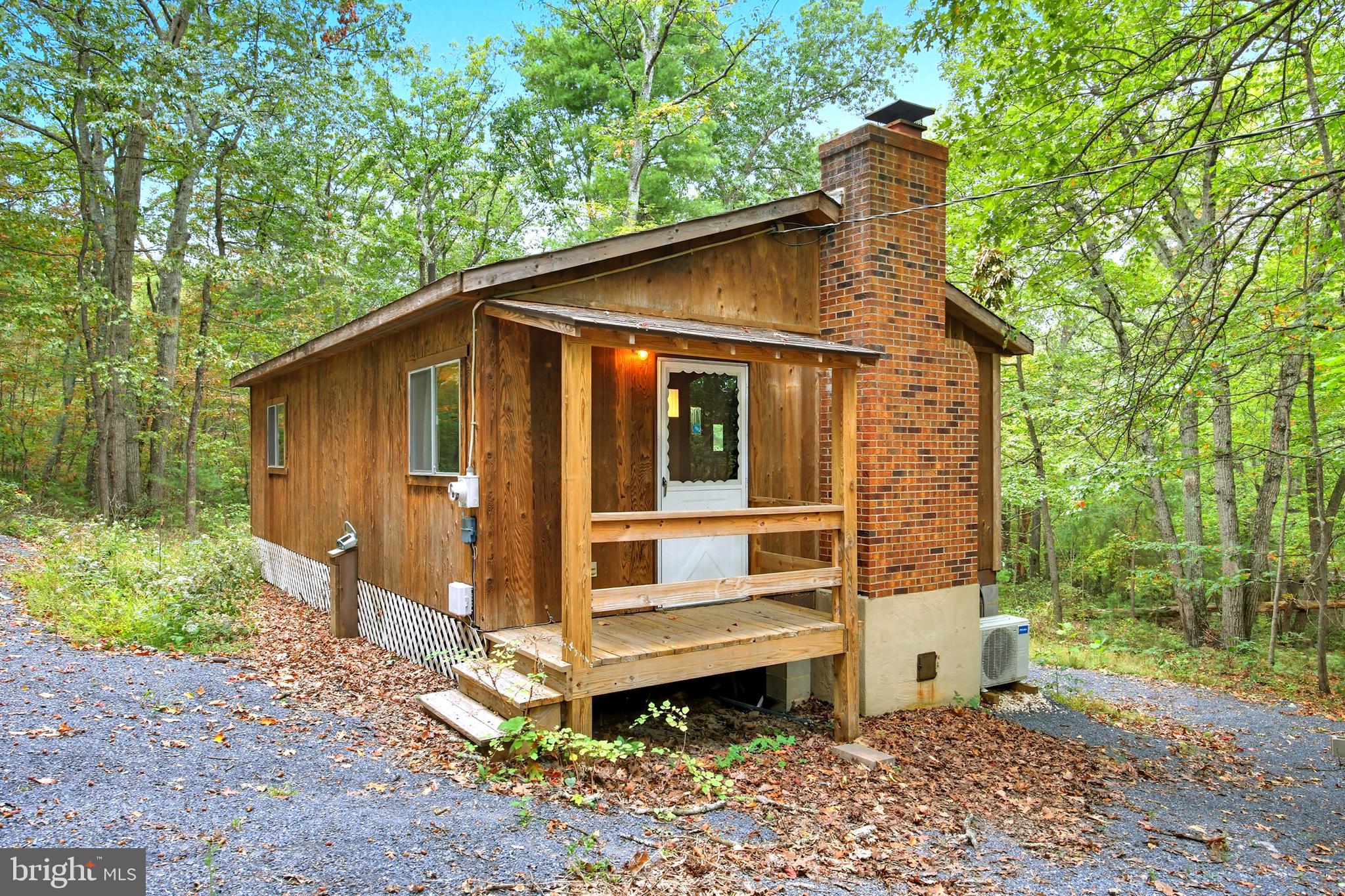 Your Shenandoah Valley getaway awaits! Nestled on 3 wooded acres and backing directly to the George Washington National Forest, this charming 2-bedroom, 1-bathroom cabin offers the perfect blend of privacy, nature, and convenience—just 3 miles from historic downtown New Market.

Inside, you’ll find a cozy and comfortable layout with efficient mini-split heating and cooling, plus a woodstove to keep things extra warm on chilly mountain evenings. Whether you are sipping coffee on a quiet morning, enjoying the peaceful wooded setting, or heading out to explore nearby trails, this property offers the mountain retreat lifestyle buyers are looking for.

Outside, a handy shed provides extra space for outdoor gear, tools, firewood, or weekend adventure supplies. The septic system has already been inspected and is ready for the new owners, offering added peace of mind.

Whether you’re looking for a peaceful weekend retreat, a full-time escape, or an investment opportunity, this cabin is your chance to own a slice of mountain living in the Shenandoah Valley.