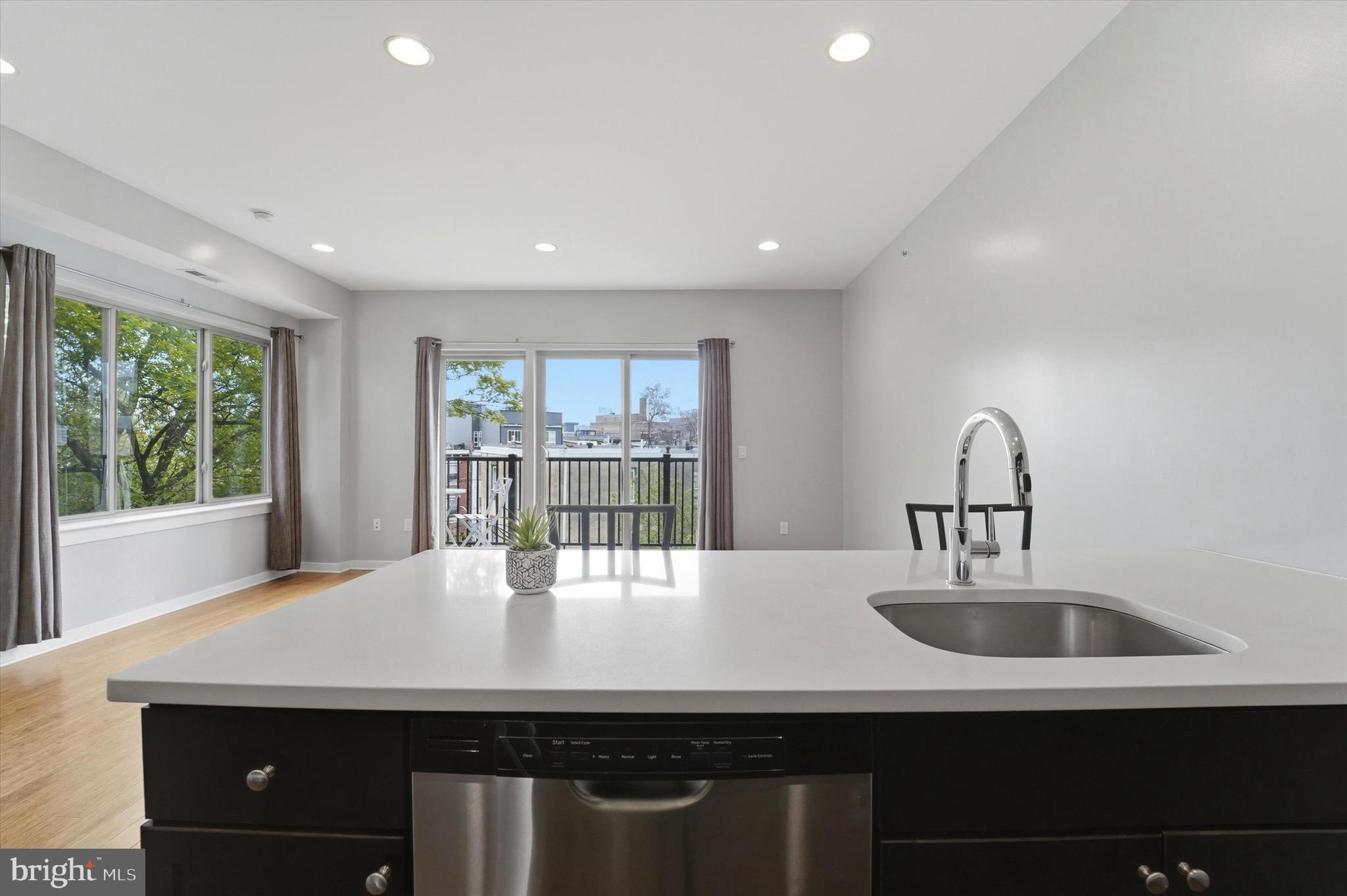 Welcome to 1608 Ridge Avenue Unit 403 a stunning newer construction 1 bedroom condo designed for modern city living. Featuring your own massive roof top deck, high ceilings and all the modern finished you could want.  The light-filled, open living area and exceptional outdoor space feature a bright open concept layout where the living dining and kitchen areas flow seamlessly together anchored by floor to ceiling corner windows that flood the space with natural light. This creates an airy inviting feel. The kitchen is both stylish and functional, featuring expansive counter space on both sides stainless steel appliances and abundant cabinetry making it ideal for cooking entertaining or everyday living. Step directly onto your private balcony spanning the living space perfect for morning coffee or evening relaxation. Then, take full advantage of your exclusive rooftop deck a true showpiece offering sweeping Center City skyline views and the ultimate setting for hosting gatherings enjoying summer nights or unwinding above the city. The spacious bedroom offers a quiet retreat with a walk in closet while additional features include an in-unit washer and dryer elevator access and modern finishes throughout. Ideally located in the heart of the vibrant Fairmount and Francisville corridor, it is just minutes from Center City, Temple University, parks, restaurants and the Broad Street Line.  This is a wonderful opportunity for a first time buyer, young professional or investor seeking low maintenance living with standout indoor and outdoor space in one of Philadelphia's most dynamic neighborhoods.  Minutes from Fairmount Park, the Schuylkill River Trail and the Museum District.  Book your tour for this amazing airy and bright condo with multiple outdoor spaces before it's gone.