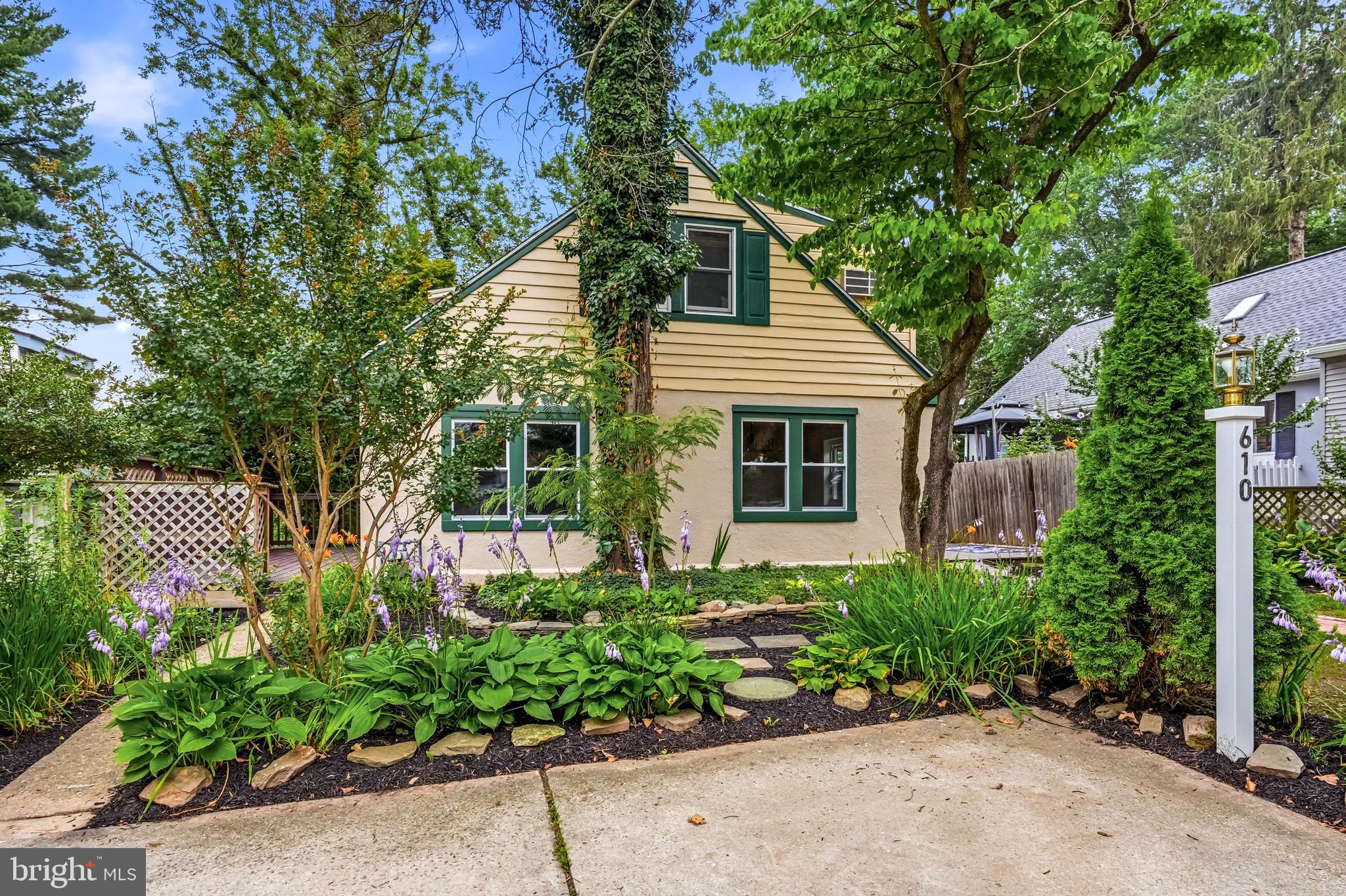 Don't judge a book by its cover - this is an extremely spacious home offering nearly 4000 square ft of usable space, including a finished lower level studio with it's own full bath, private entrance and full sized windows.

Located in West Chester Boro a little over a block from Everhart Park, and less than a block to Horace Pippin park, this property is a must see.

Two off street parking spaces = gold in West Chester Boro. The yard is nearly a quarter acre, which is another rarity in the Boro. It's the perfect place for your four legged friends to stretch out or watch deer graze.

Take a quick 4-5 block walk and you're in the heart of West Chester Boro with an array of fantastic restaurants, boutiques and coffee shops.

The house itself is quite unique and lends itself to multi-generational living or a house hack room mate situation.

On the main floor is a generously sized kitchen and dining room, plus a first floor bedroom, full bath, laundry, mudroom, butler's pantry with wet bar and oversized living room, plus plenty of closet space.

The kitchen is light and bright with ample cabinet and counter space, a double wall oven, new gas cooktop and room to eat-in or add an island.

Wood ceilings and a classic stone fireplace anchor the huge living area - almost 650 sq ft. Reclaimed barn wood accents one wall making the space one of a kind. It's one of the focal points of the home and a great place to entertain and gather.

The second floor offers two more bedrooms with ample closet space, an updated full bath with granite top vanity - plus closets at the top of the stairs and a skylight to keep it bright. The rear bedroom has sliders to the roof above the family room and a small deck area. This could be expanded into a huge rooftop deck if desired.

There's a proper lair in the unfinished part of the basement which has 9' + ceilings. This is a great spot for a workshop, band practice, lounge, storage, mad scientist lab, or any combination of these.

A full bath, separate entrance, kitchenette area, and plenty of daylight make the finished part of the basement a great 4th bedroom or suite. It also has high ceilings and it's own deck overlooking the year yard.

A total of 3 decks, plus the roof deck offer up a ton of possibilities for outdoor living and entertaining.

Iconic Everhart Park is a great place for a stroll and has play areas, basketball courts, open green space and shaded paths too. It hosts events throughout the season like the Turk's Head Music fest, yoga in the park and art festivals. Horace Pippin Park has a play area, a basketball court and baseball field.

Groceries, hardware, and drugstores are walkable. Minutes to Stroud Preserve and many more natural areas.

If you need a lot of elbow room and yard space in West Chester Boro - this is the place.