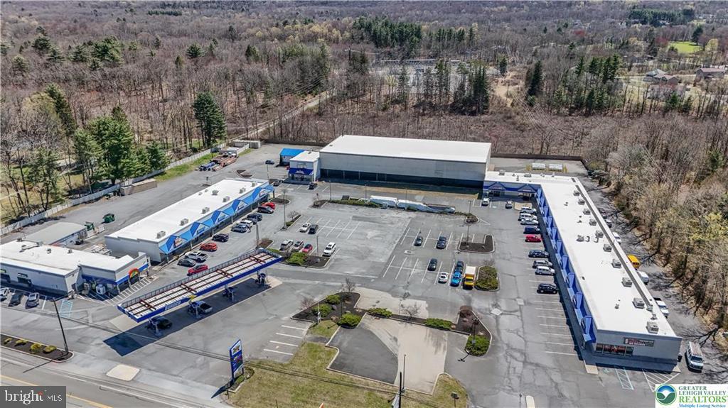 Marshall Square Shopping Center a local neighborhood shopping center is now available to purchase! Located in the Pocono Mountains vacation area serving permanent and seasonal residents. The Property includes nearly 40,000 sqft of strip mall space with 22 stores/units fully rented, Service station with 4 double sided fuel dispensers/pumps and a large convenience store, 20,000 sqft of flex space ready for build out and perfect for a medical facility, grocery store, office space, hardware store, fitness center or possible 7 additional rental spaces. A large pylon sign listing all the tenants of the mall and large digital price sign for the Sunoco fuel station. Route 209/Milford Road has a vehicle traffic count of approximately 20,000 vehicles per day. Over 6000 est. households within 5 miles, with an estimated population of 20,000 with an average income of over $75000.00 per house hold. This area is primed for growth, many major franchises and medical centers opening nearby including St Lukes and Lehigh Valley Hospitals, New Hotel and Resort directly across the street, additionally several dining franchises.