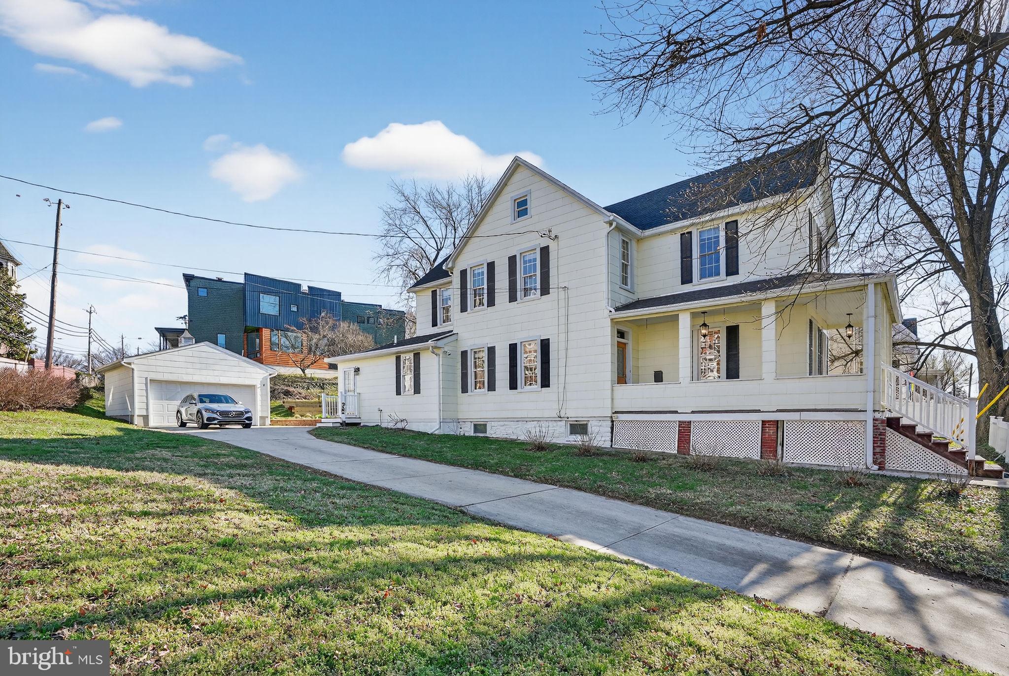**Seller request all offers to be received by Monday 03/30 by 5PM** Welcome to 1007 Roland Heights Ave, where past meets present featuring 2 CAR GARAGE, LONG DRIVEWAY and a rare MASSIVE TRIPLE LOT.  Who says you can't have it all? Best of both worlds, Roland Park meets Hampden. Tall 9 feet ceiling and generous room sizes starting off with a HUGE KITCHEN often found in large homes, 3 large bedrooms & 2 renovated full baths and a fully finished attic space. Historic charms meets modern comfort & efficiency. UPDATES: New main roof (Dec. 2025), Dual zoned HVAC with smart thermostats (2020), water heater (2022), Pella replacement windows, LG, Bosch, GE appliances (2021-2023), bath renovations (2022), recessed lighting, blown insulation, paver patio with retractable awning, covered front porch! Power lift GARAGE has 240V for EV charging! Walk to both Rotunda & Hampden for shopping, dining, fun in minutes! Roland Park water tower has concerts that brings the community together. Truly a rare find!