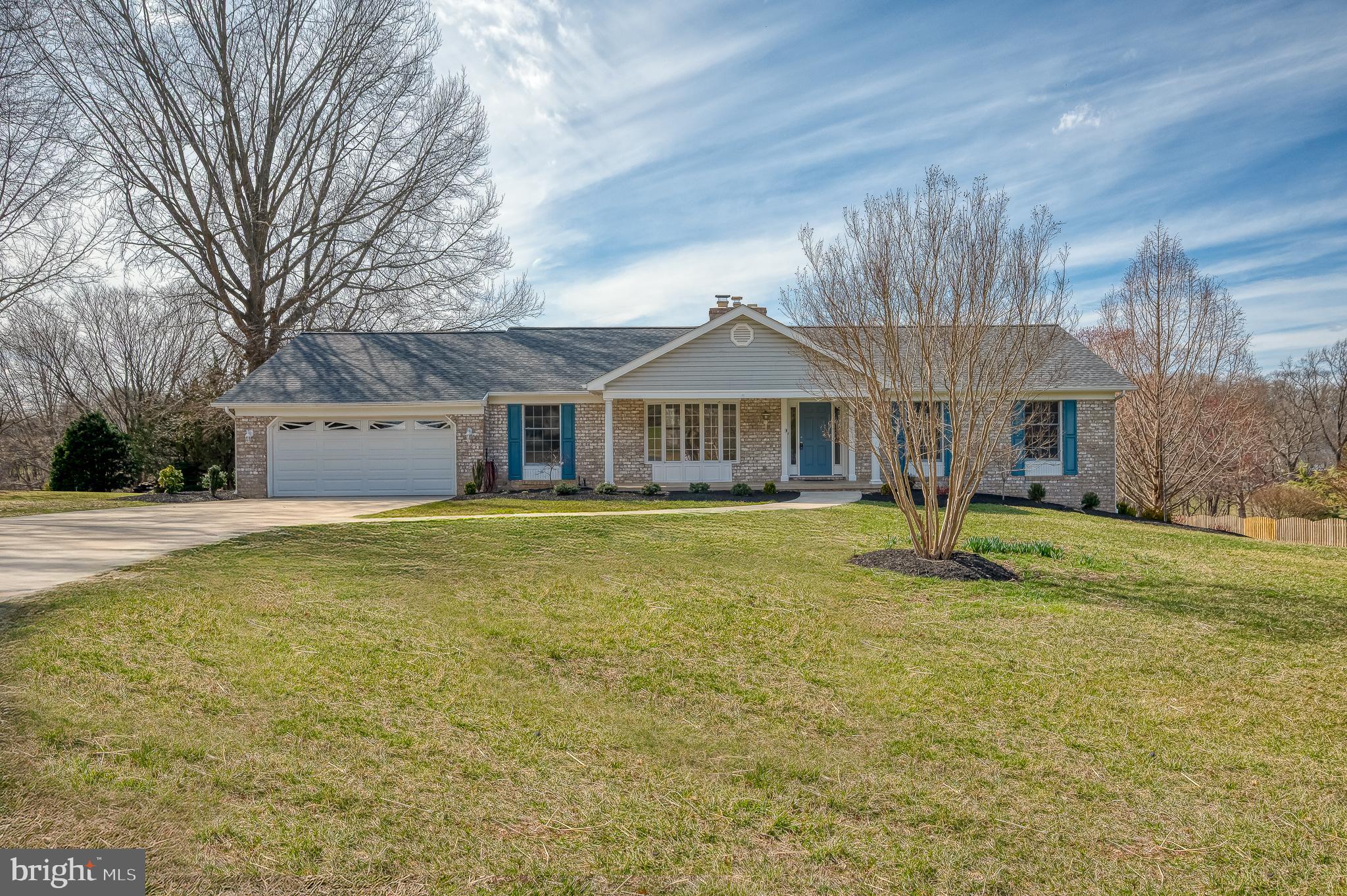 This is the home you have been waiting for! This stunning 2 car garage rancher on a small cul de sac is situated on a sprawling lot that backs to trees! This immaculate rancher has 4 bedrooms with a possible 5th bedroom/office in the lower level. Main floor features 3 bedrooms and 2 full baths, one of which is an ensuite with double sinks. The recently remodeled kitchen has quartz counters and beautiful upgraded cabinets. Off the kitchen the laundry/butler's pantry is a dream with a second sink, pantry closet, shelving, cubbies and front loading washer and dryer. The family room boasts a gas fireplace and plenty of windows overlooking the private backyard with access to the maintenance free deck. In the basement you will find a large light filled great room with a propane stove, 2 additional rooms with egress access, full bath with walk in shower and a kitchenette perfect for a bar and entertaining or an in law suite. This home is absolute perfection! Roof 2024, Well Tank 2025, new paint 2025 and much more! Thoughtfully updated and well maintained it won't last long!