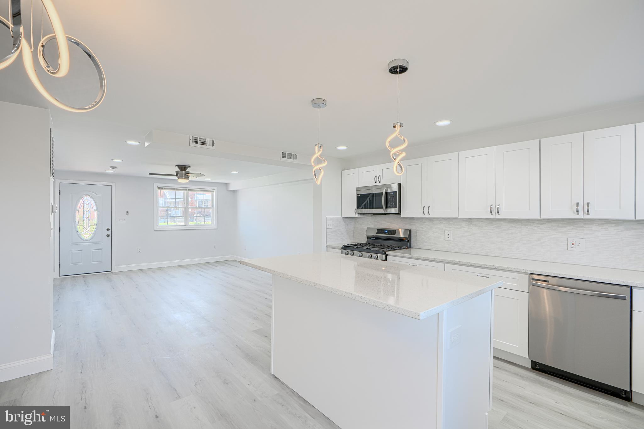 Wake up every morning, and say, I can’t believe I live in this amazing home! Open layout! Gorgeous kitchen with oversized Quartz countertop and island, coordinating backsplash, wood shaker cabinets, and stainless steel appliances. Upstairs dual entry bath is elegant and comfortable, with custom Calacatta tilework and designer plumbing and lighting fixtures, plus a spacious closet. Direct access from Master Bedroom to bathroom. Bedrooms feature extra wide closets with sliding mirror doors. Fully finished basement features a family room and 4th bedroom which has a private full bathroom with custom tile shower. And it is on walkout level, with quick access to the multi-car driveway. This home has a front porch, and a new large deck, fenced in yards, coordinated lighting and plumbing fixtures, new doors interior and exterior, recessed lighting, new HVAC system, Luxury vinyl plank flooring. You will love this home.