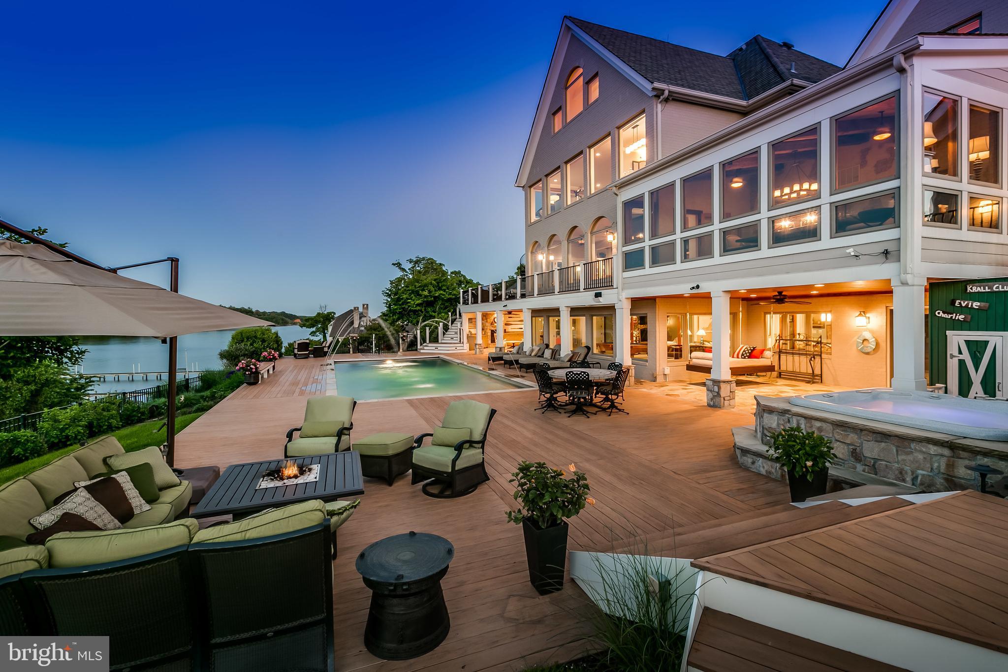 Breathtaking sunrise views of Severn River from this beautiful custom 12,332sqft home exquisitely renovated in 2008. Luxurious features throughout. Lavish mstr suite w/stunning view. Gourmet kit w/2 SubZero's & Wolf range. Coiffured ceilings, 6 fireplaces, theatre, sauna & steam rm. Gorgeous Pebbletech waterside pool, spa, fireplace & fountains. Private deep water pier w/3 slips (2 lifts 12k & 20k)