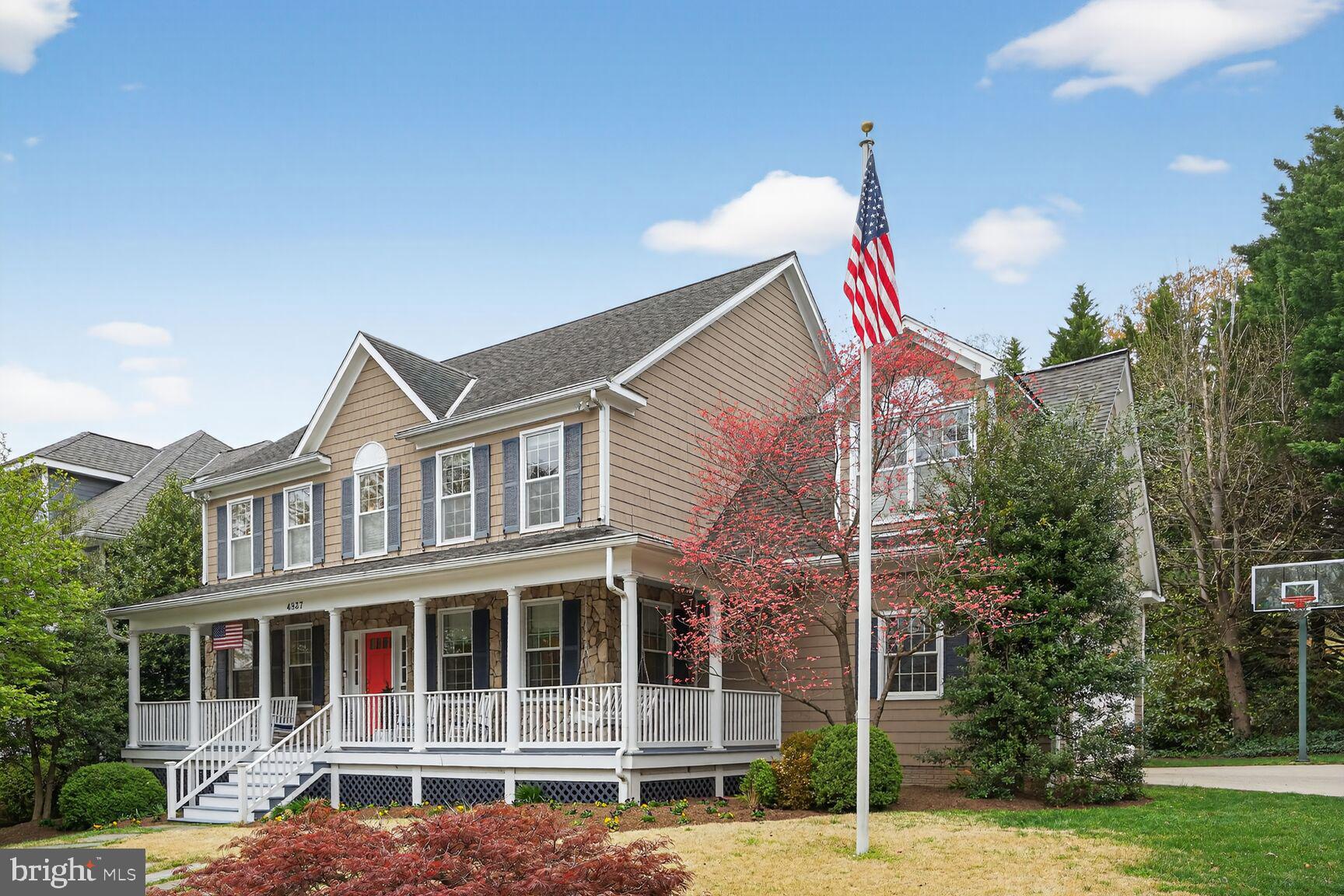 **Open House Saturday, 06/27 from 2:30pm to 4:30pm ** Perfect spot to host friends for brunch and WALK 1.5 blocks to the Palisades Fourth of July parade.  Nothing screams good-old-hometown-America more than the Palisades Fourth of July parade down MacArthur Blvd..  Welcome to 4837 W Street - this home was built for spacious comfortable living and festive entertaining. The wrap around front porch invites you to come and sit a while on a rocking chair or swing before heading inside.  The center hallway provides great flow from every room on the main level with 9 foot ceilings  and crown moldings throughout.  The living room is bright from 6 windows including a bay window and the perfect spot to host guests and refresh their drink from the fully equipped  wet bar with beverage refrig,  sink and marble countertops.   The dining room is ideal for more formal meals while the eat-in kitchen is the hub of the house, overlooking the backyard with lovely landscaping and hardscaping, family dinners will be easily prepared from the gourmet kitchen (Double oven Thermador gas cooktop and SubZero refrigerator).  A center island has extra seating for quick snacks or homework.  The hallway tucked between the dining room and kitchen leads to the mudroom with built-ins for coats, backpacks, sports equipment and more and leads to the 2 car garage. Just off the center hall is the coat closet and powder room.  The family room adjoins the kitchen and is outfitted with a gas fireplace with built-ins on either side as well as sliding doors to a spacious screened porch.  With both a dining area and living area, this porch will provide year round space for entertaining or cheering on your favorite sports teams.  Skylights bring in added light and exposed beams add to the character.   Entertaining a big crowd?  No problem, just outside the screened porch is a patio with a built-in gas grill, refrigerator, long counter and a serpentine stone wall with woodburning fireplace and bench seating with plenty of room for your guests.  A waterfall and pond provide the soft sounds of nature and attracts blue birds and cardinals among other feathered friends.  The second floor has the primary suite PLUS three more good sized bedrooms with two full baths .  The primary suite has his and her custom closets and a spacious full bath with soaking tub, separate shower, double vanity and heated tile floor.  There is a laundry room with custom shelving and built-ins as well.  The lower level provides additional living space with a large open family room with gas fireplace, built-ins and access to the backyard, an additional kitchenette with refrigerator, dishwasher and microwave plus cabinets and a breakfast bar.  Two additional rooms can be used as needed - bedroom with adjoining full bath, office, gym - whatever suits you.  There are several storage closets on this level as well and the utility room with storage space.  This well cared for and fully updated home is move-in ready.  Additional features include - 2 zone heat/ac, heated tile floor in primary bath, additional refrigerator and freezer in garage, Pella windows and doors.  Built-in speakers throughout the first floor (including surround sound in family room), primary bedroom and bath plus lower level tv area; freshly refinished wood floors on 1st and 2nd floor; all 4.5 baths completely renovated within the past 3 years; crown molding on 1st floor; walk-in pantry.